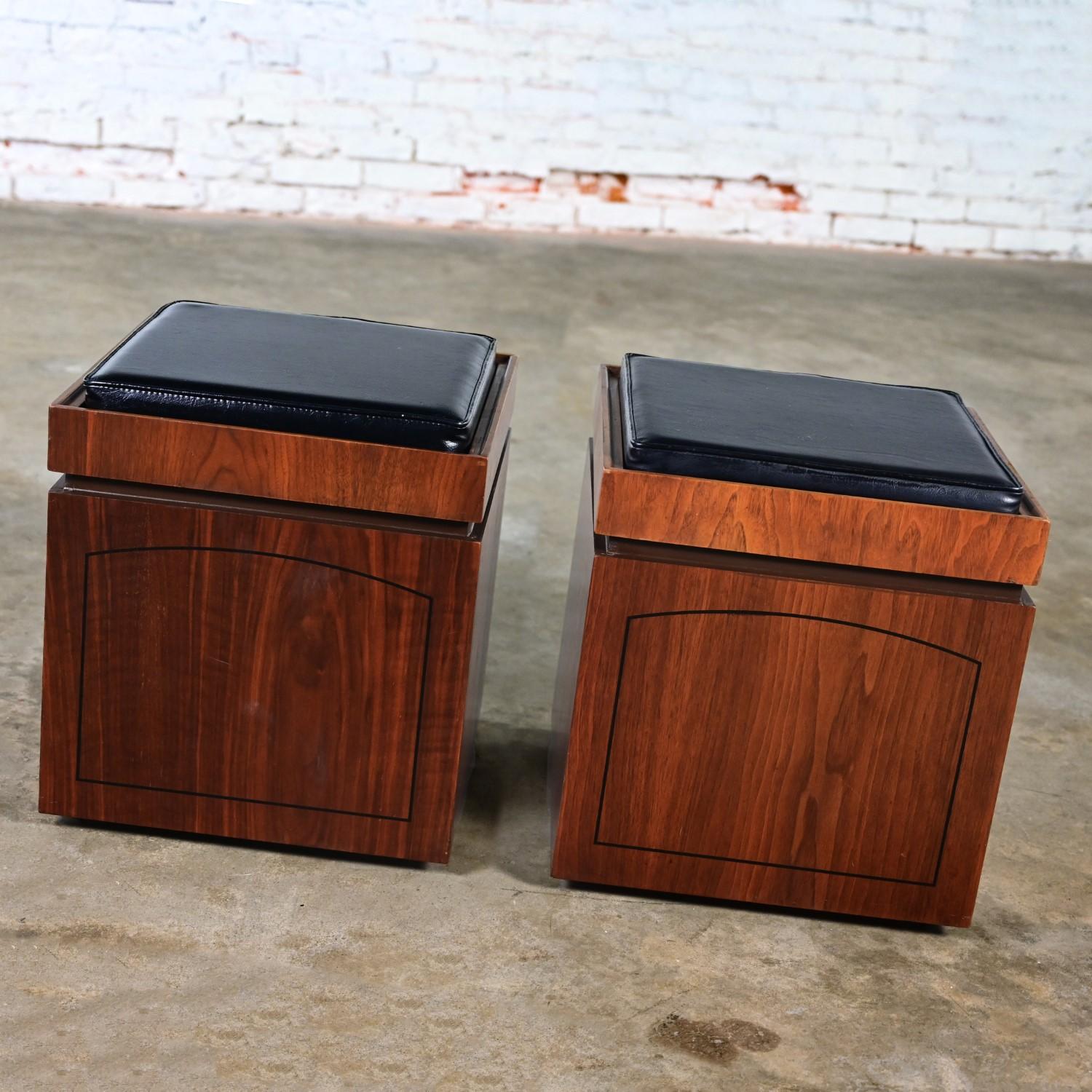 Awesome vintage Mid-Century Modern Lane Style No. 997-87 rolling cube storage ottoman walnut veneered cedar lined end tables with flip tabletop game board on one side black vinyl or faux leather upholstered on the other side, a pair. Beautiful