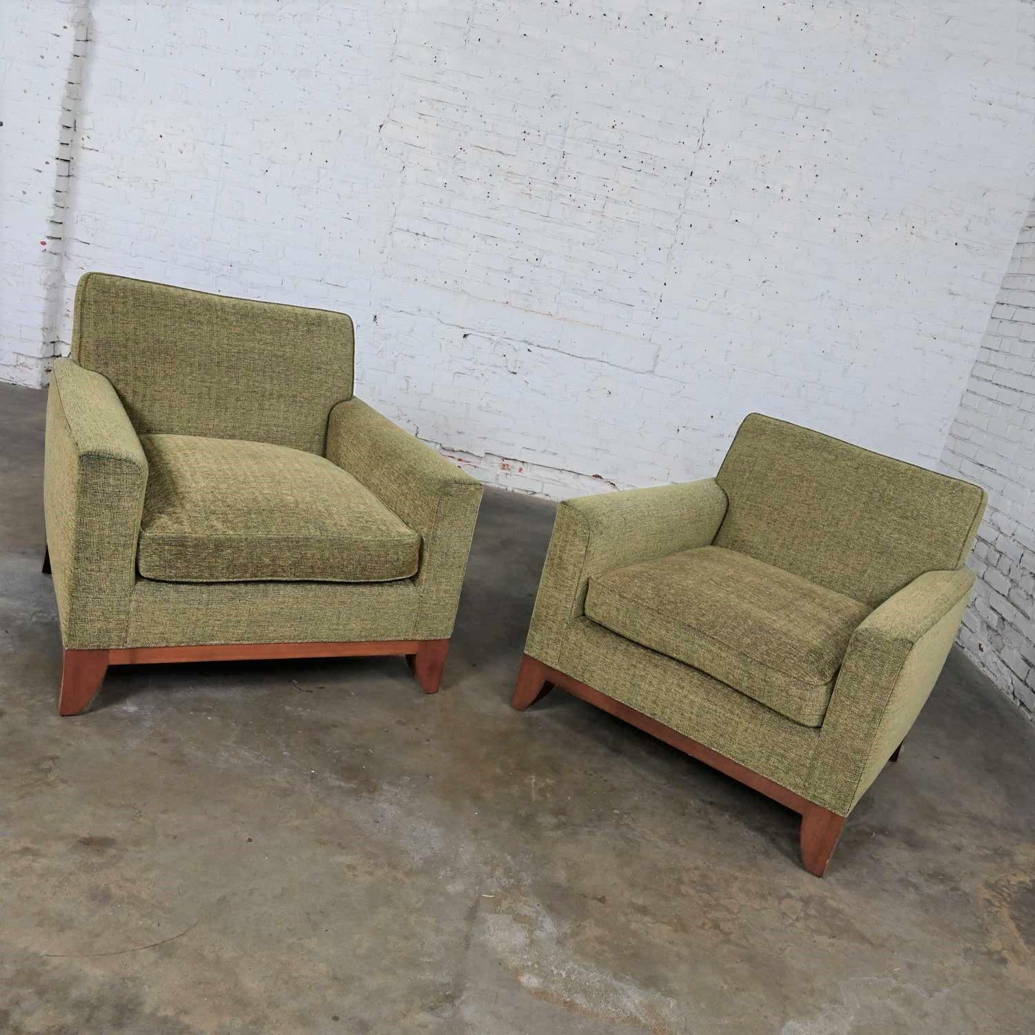 Spectacular vintage Modern custom-made Lawson style large scale club chairs khaki with olive green overtones, a pair. Comprised of upholstered frames, a feather down wrapped foam loose zippered seat cushion, square tapered legs, and light mahogany
