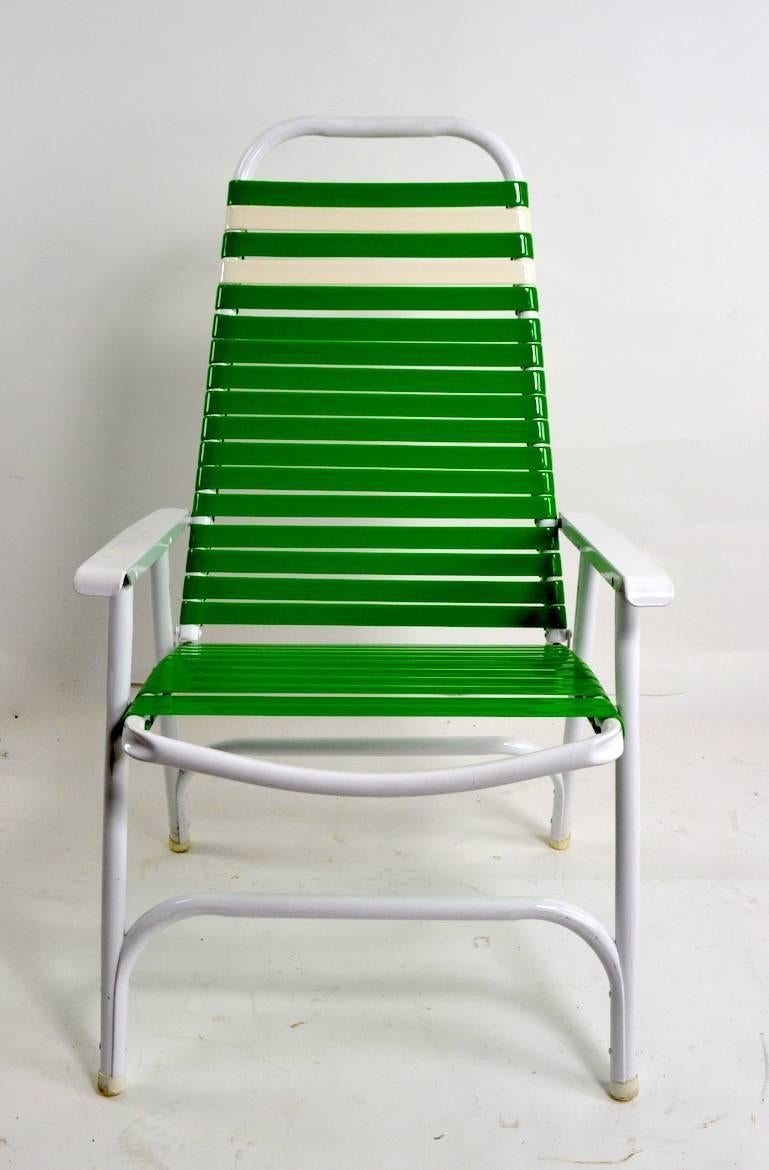 Bright and cheerful folding lawn, poolside, garden chairs, by the Telescope Chair Company. Offered individually, however we would love to see them stay together. Measures: Arm H 22 x seat H 17 inches.