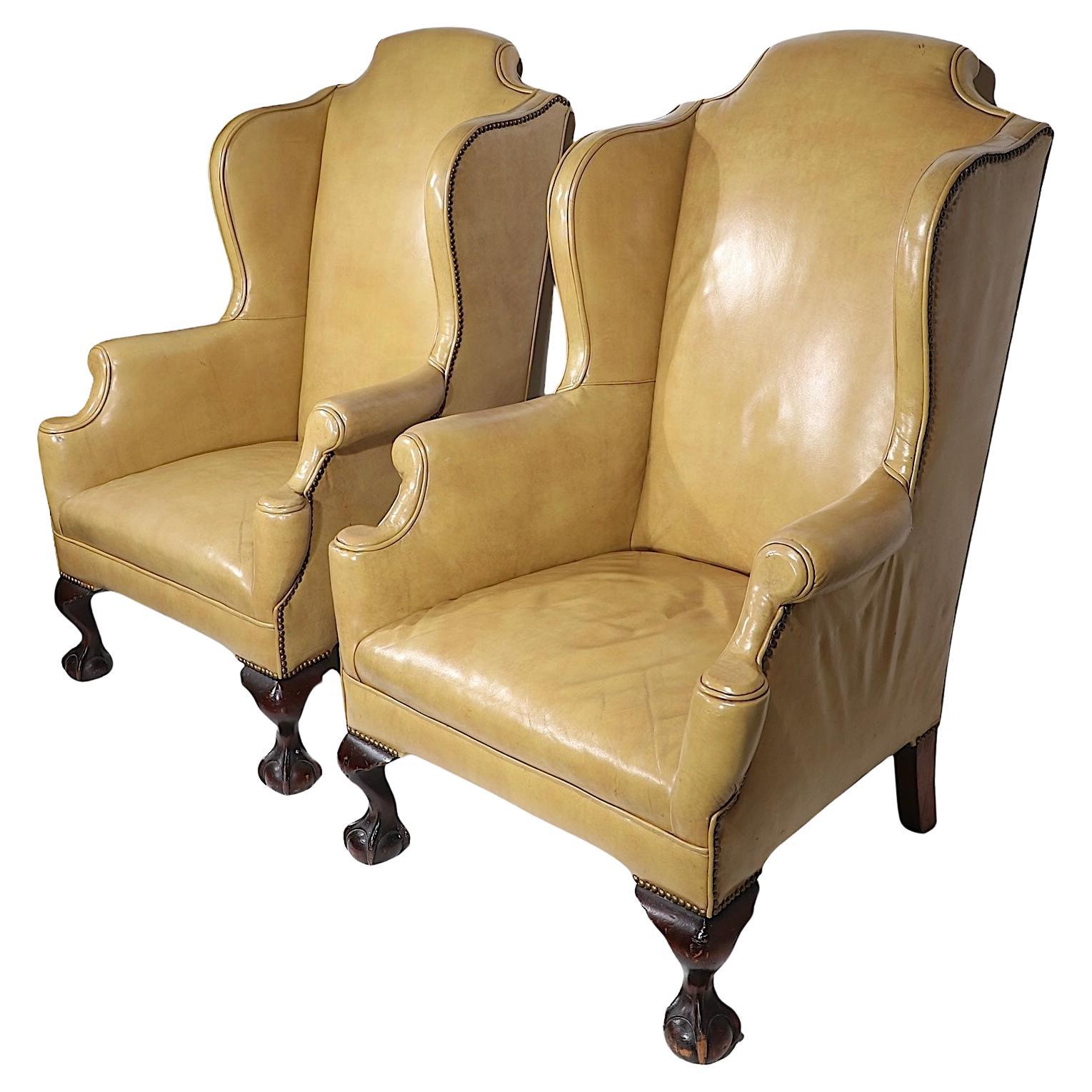 Pr. Leather Wingback Chairs with Ball and Claw Feet and  Nailhead Studs 