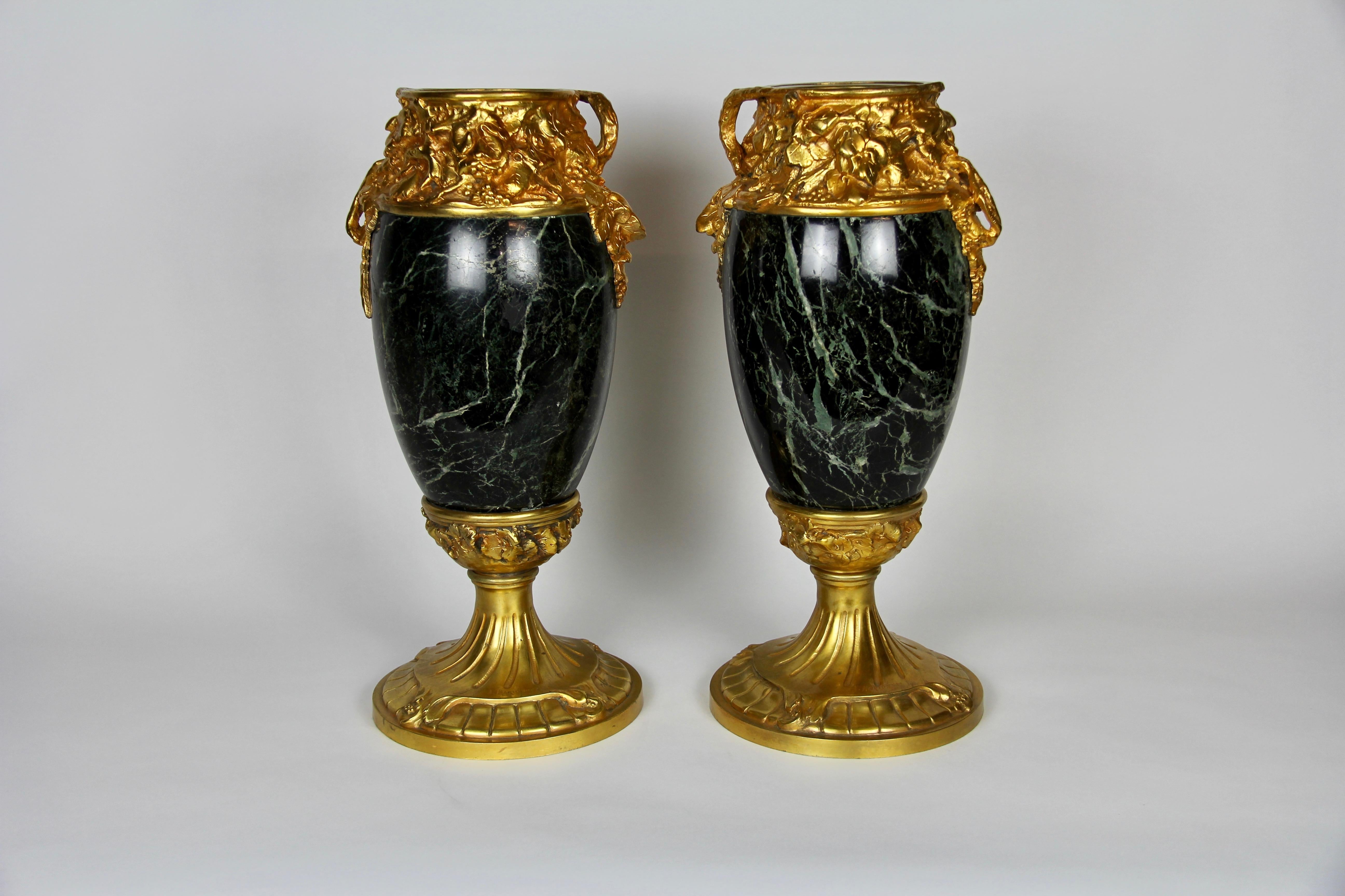A fabulous pair of French Art Nouveau Dore bronze mounted Verde Antico marble vases, signed A. Marionnet. Of ovoid form with beautifully hand-carved Verde Antico marble body. The bronze is cast, hand-chiseled, and chased with decorations of birds,