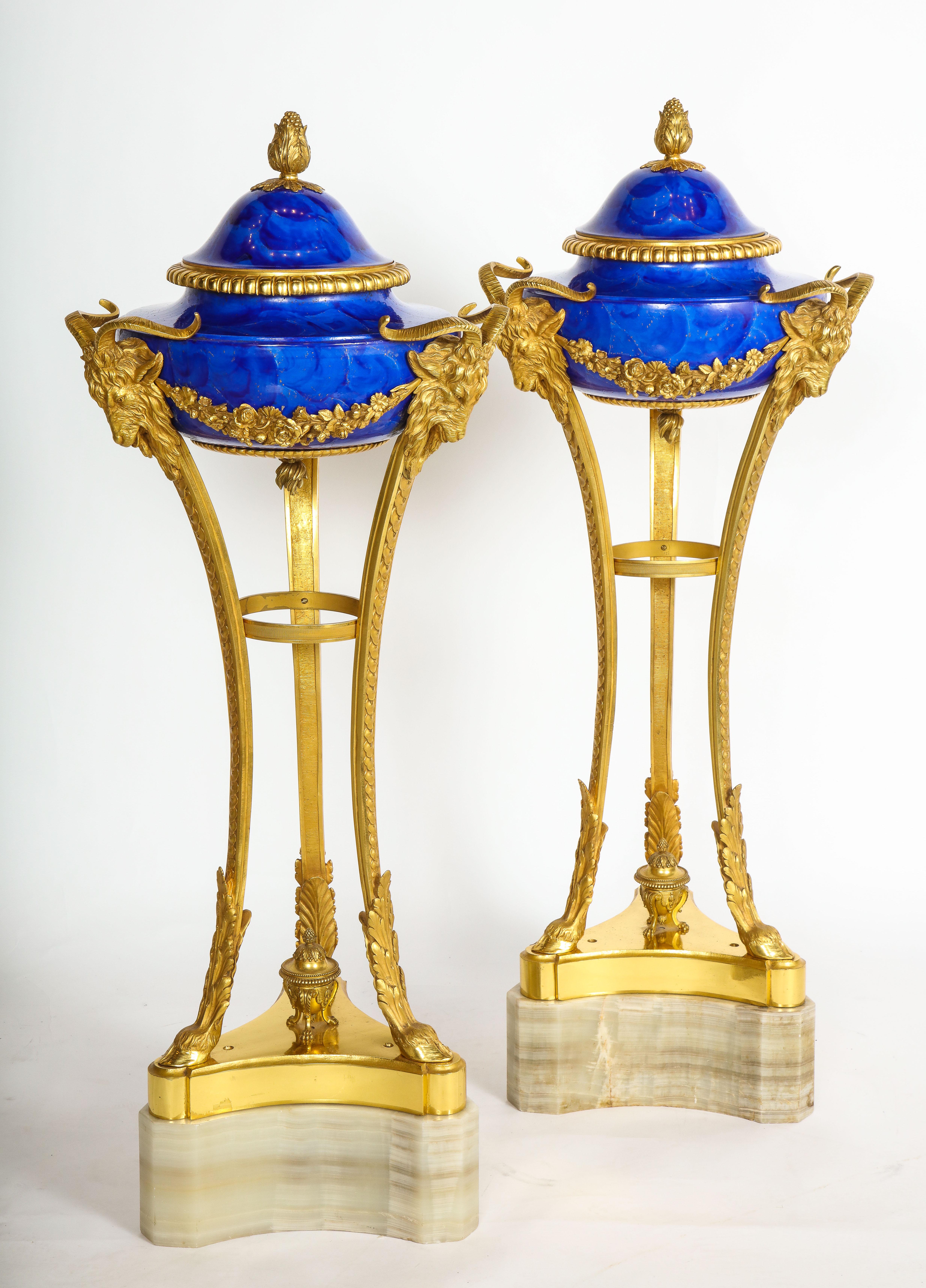 A Monumental Pair of Louis XVI Style Dore Bronze Mounted Faux Lapis Lazuli Hand-Painted Sevres Porcelain Athenians/Cassoulets on a Triangular Onyx Base, Most Probably Commissioned for the King. These are truly a masterpiece. Each section of the