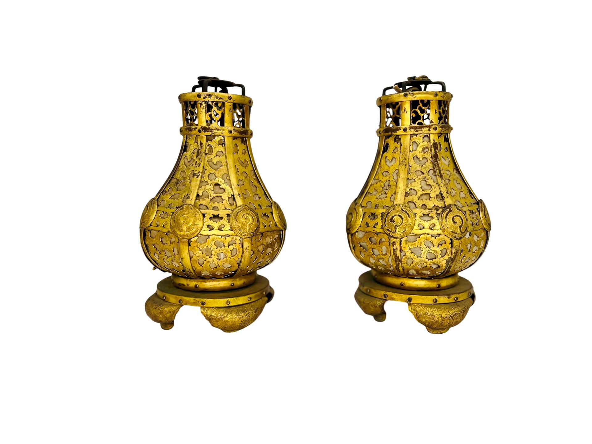 Japanese, (meiji era 1868–1912). 

An absolutely stunning pair of Japanese Meiji period gilt bronze and brass lanterns. Each hand cast bronze oval openwork 