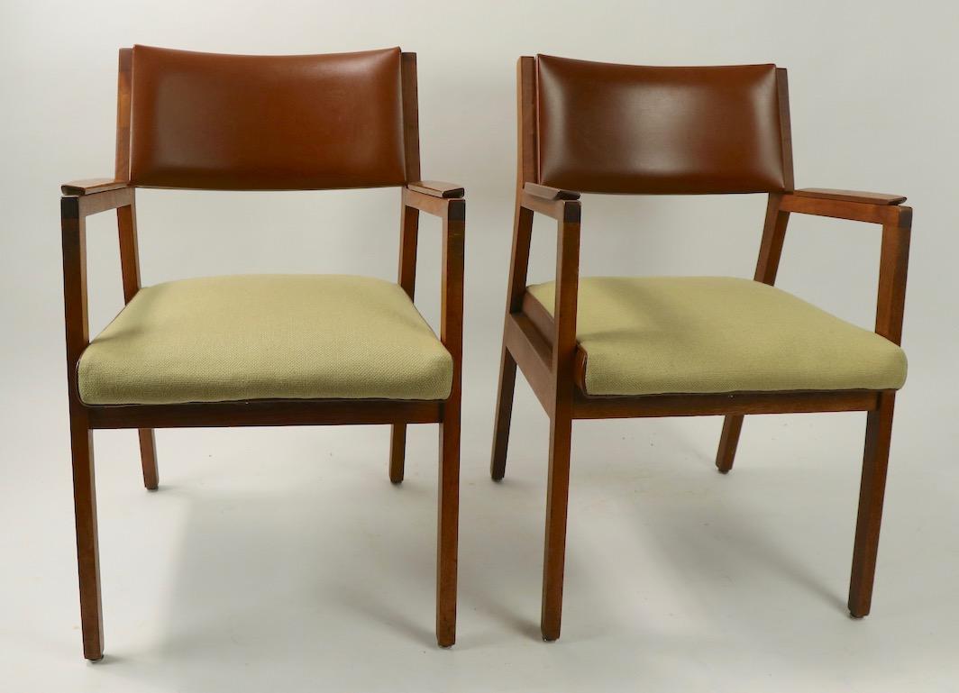 Pair of midcentury architectural design armchairs by ALMA. Chic two-tone upholstery color way having medium brown vinyl and light tan fabric elements. Suitable for use as side, accent, office or dining chairs. Sharp and stylish lines, great quality