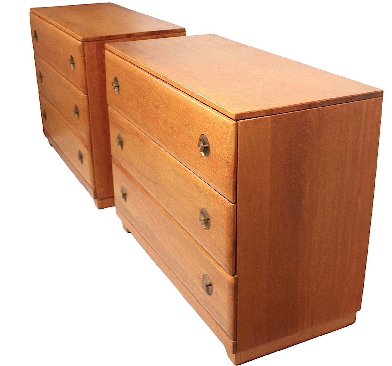 Sophisticated mid century bachelors chests, in original cerused oak finish, with recessed brass pulls. Each chest has three deep drawers, both are in very good, clean, original, ready to use condition, showing only light cosmetic wear, normal and