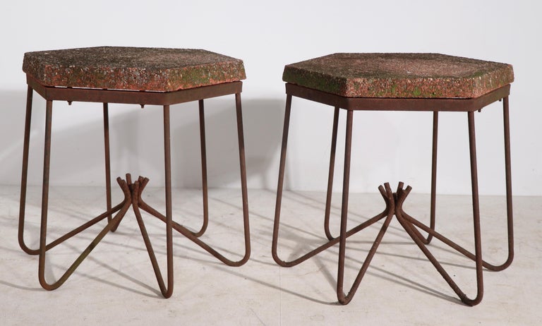 Pair architectural mid-century garden, patio, poolside tables in Grey Gardens, allover rust patina, with cast stone tops. Chic and stylish tables, with wonderful aged finish, offered and priced as a pair.