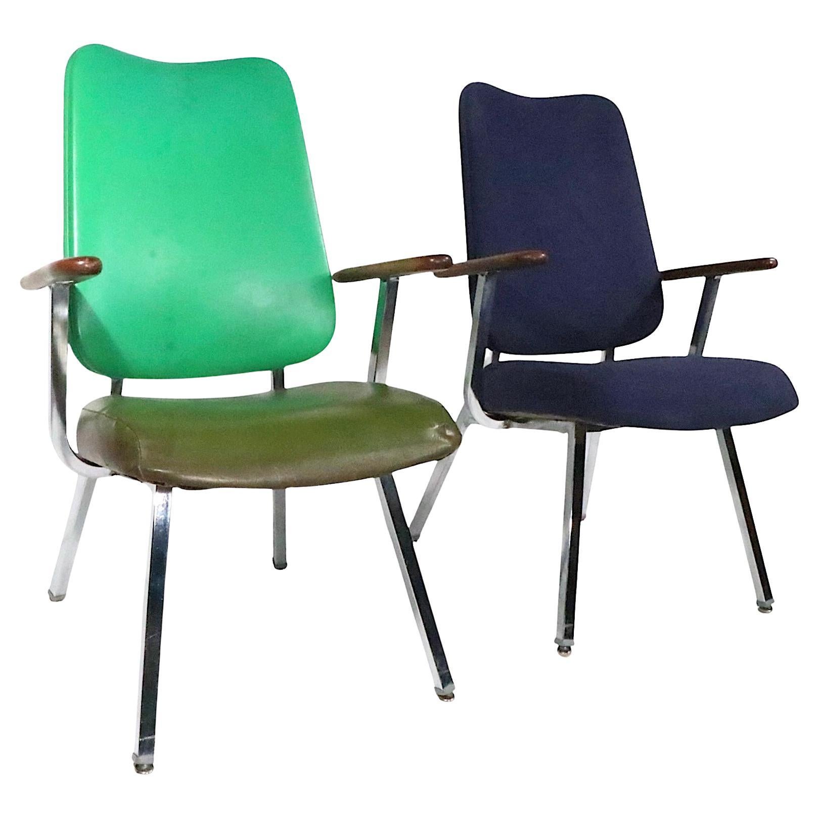 Pair of stylish  Mid Century high back office, or lounge ,chairs  - made in the USA by the  Dellwood Furniture United Chair Division, circa 1970's. The chairs feature  squared bright chrome frames with floating wood armrests, and unusual sculptural