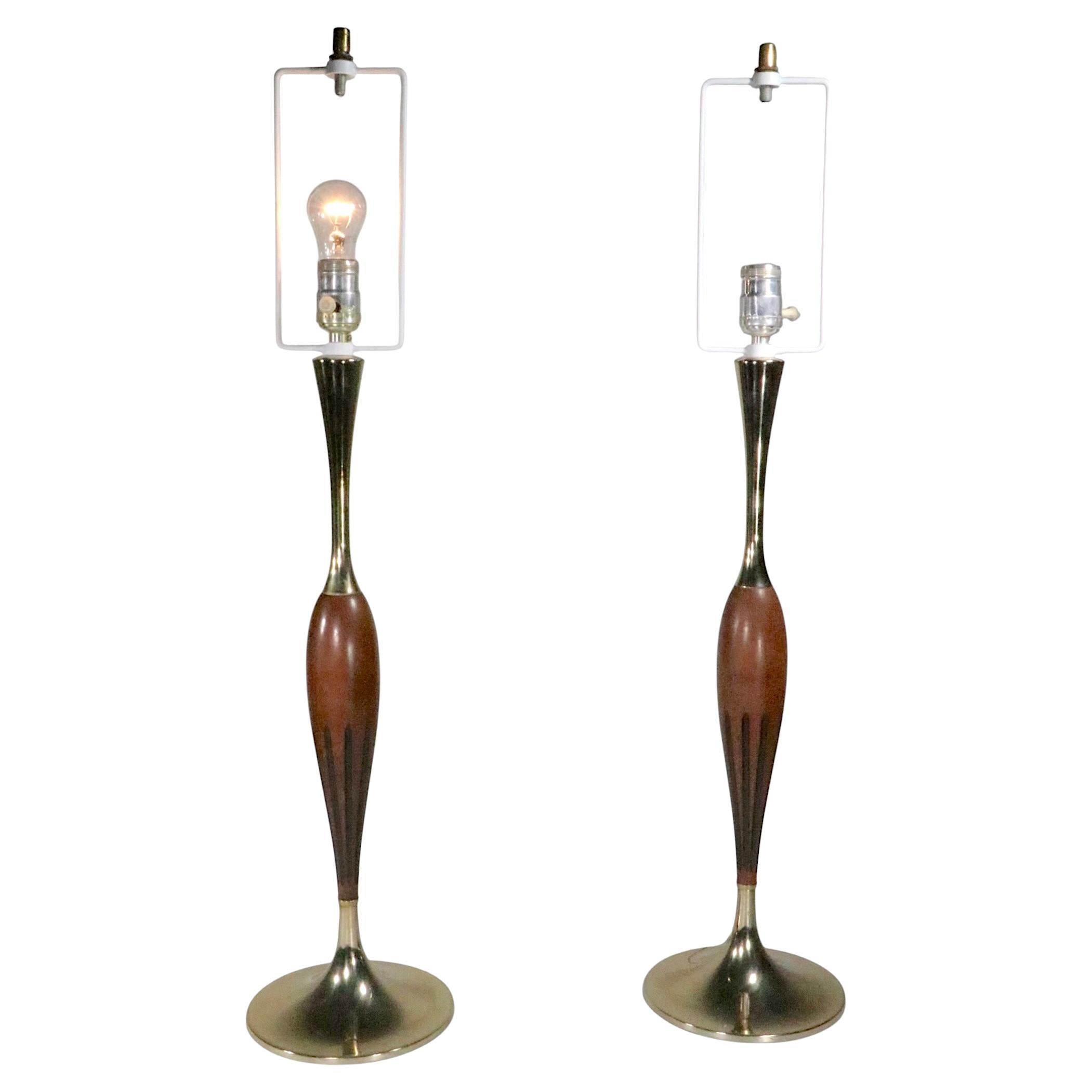 Exceptional pair of Mid Century table lamps, made by the Laurel Lamp Co. circa 1950/60's.  The lamps are in very good, original, clean, working ready to use condition, showing minor cosmetic wear, normal and consistent with age. 
 Specifically one
