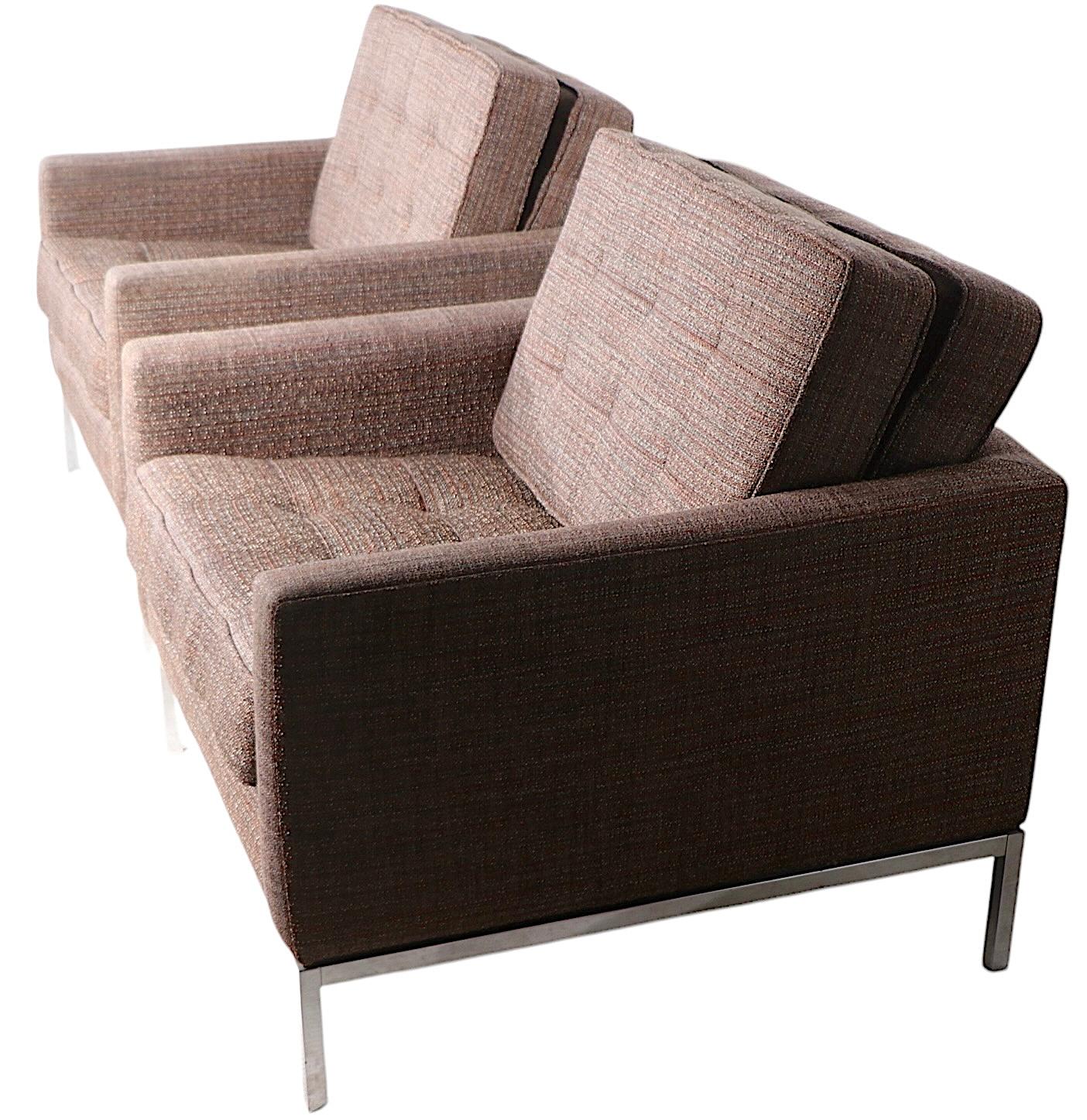 Pair of iconic mid century club chairs designed  by Florence Knoll for Knoll Associates ( Park Ave ). These chairs are in very good, clean, ready to use condition, they were  reupholstered several years ago. Arm rest fabric shows some light wear,