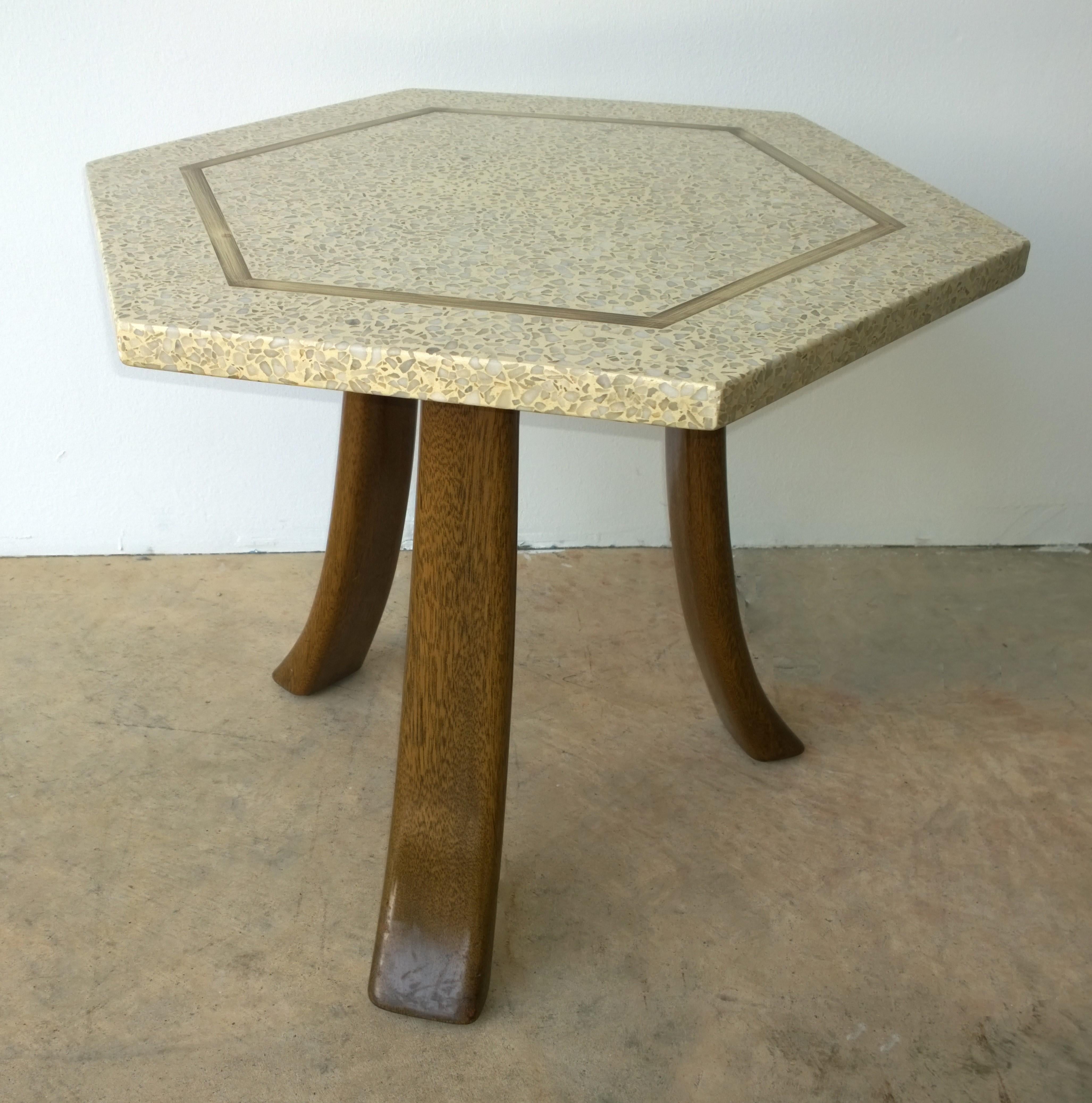 Offered is a pair of Mid-Century Modern Harvey Probber aqua blue and white terrazzo stone hexagon shaped top with brass inlay, on splayed tripod brown mahogany legs. The iconic Harvey Probber tripod side table design was produced with a cream