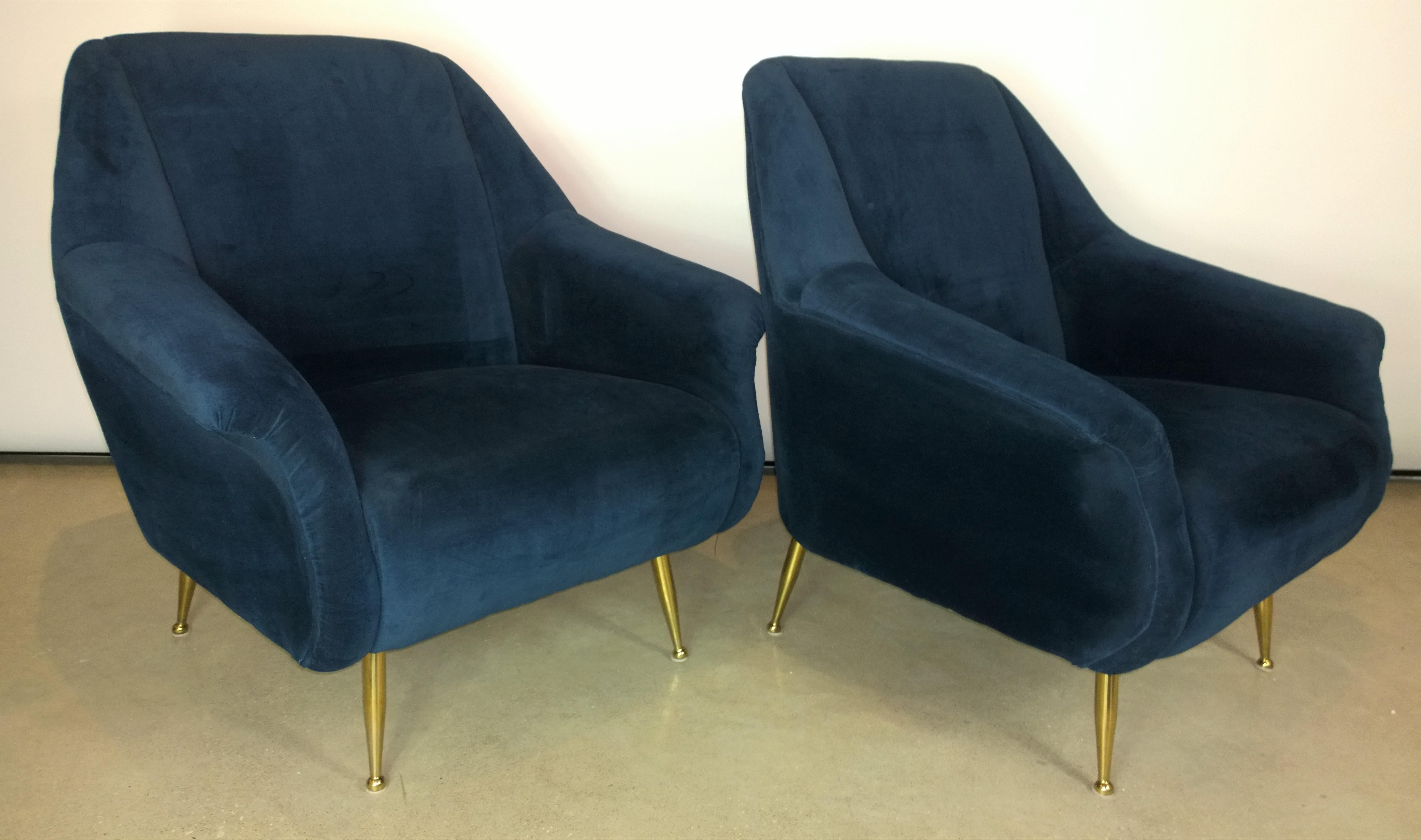 Offered is a pair of Mid-Century Modern Italian Marco Zanuso style navy velvet and new brass legs lounge or armchairs. The navy blue velvet is quite a luxe update to the chairs along with new shiny brass legs. We purchased the chairs already