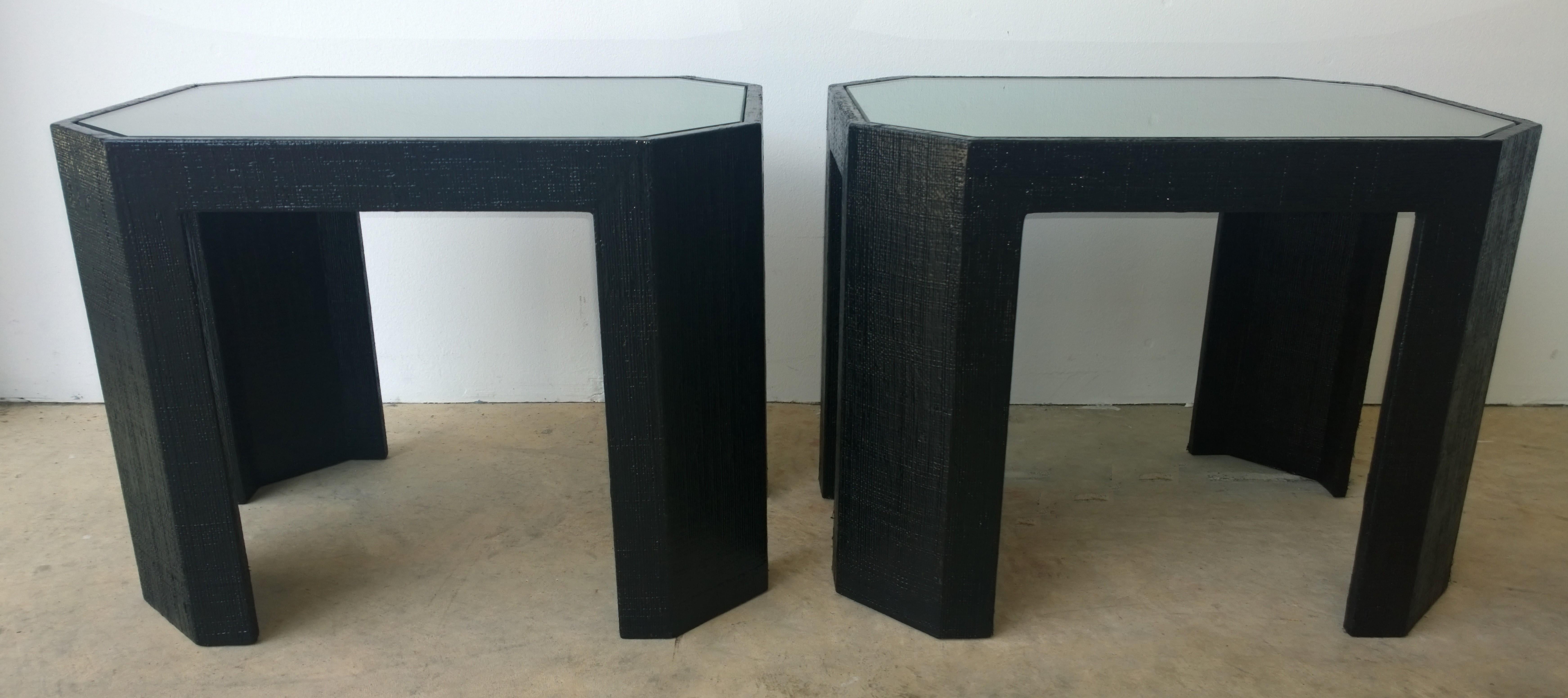Offered are a pair of Mid-Century Modern Lorin Marsh LDT newly lacquered in black grasscloth with inlaid rectangular with niched corners inlaid glass tops side / end /bedside tables. Lorin Marsh, founded in 1975, is a high end luxury custom