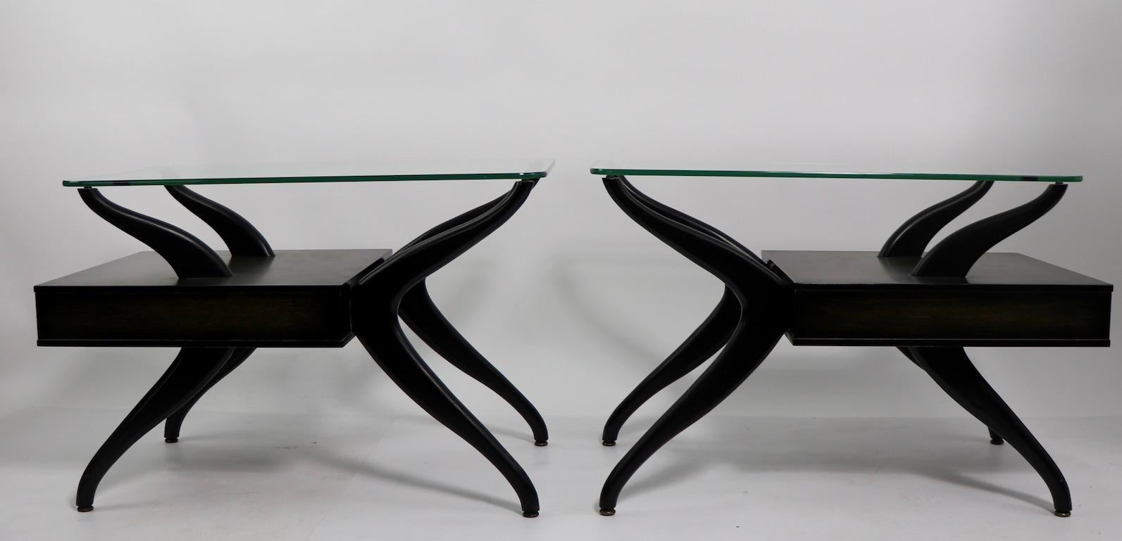 Sexy pair of mid century end, or side tables, each having a thick plate glass top, and a pull out drawer. Both are in very Fine, original condition, showing only inconsequential cosmetic normal and consistent with age. Design in the style of