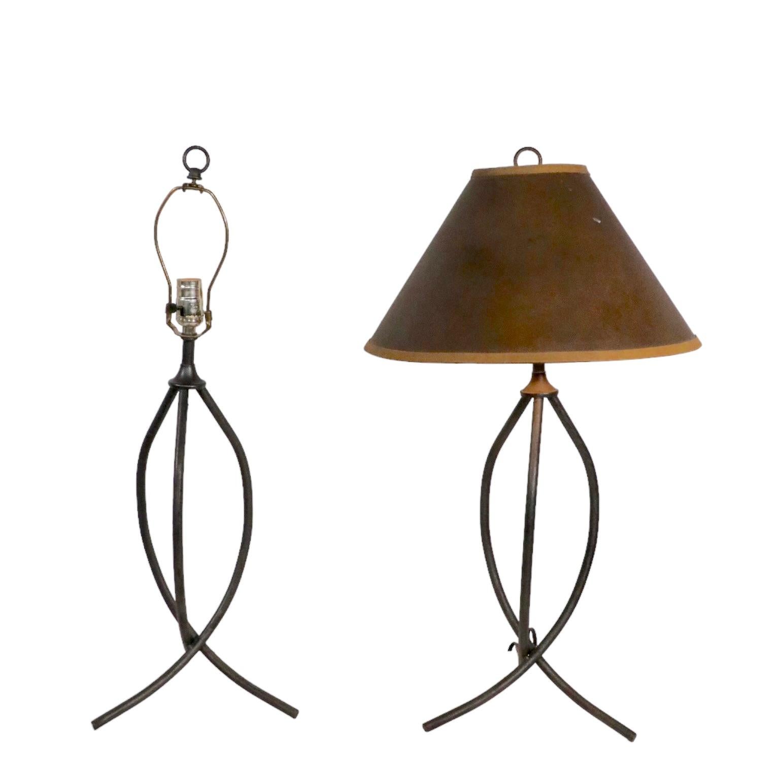 Chic architectural table lamps of intertwined wrought iron legs. The lamps are in very good original condition, clean, working, ready to use condition, showing only light cosmetic wear, normal and consistent with age - shade not included. Design