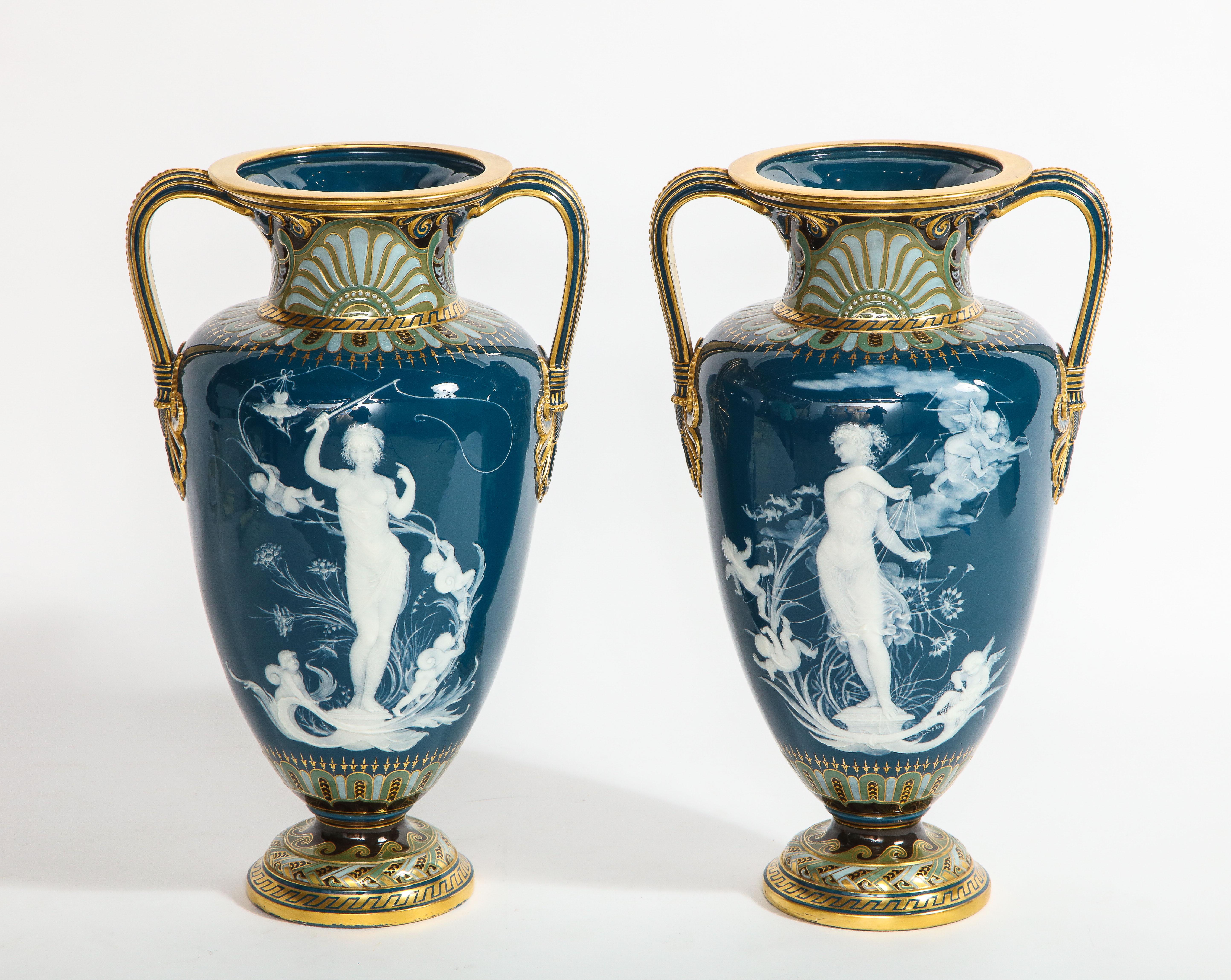 A monumental, rare, and highly important pair of Mintons Pâte-Sur-Pâte Peacock-Blue-Ground Vases, Known as 'Too Fast' And 'Too Slow' Produced in 1893, signed by Louis Solon. Shape number 3044, decorated by Marc Louis Solon, signed L. Solon in white