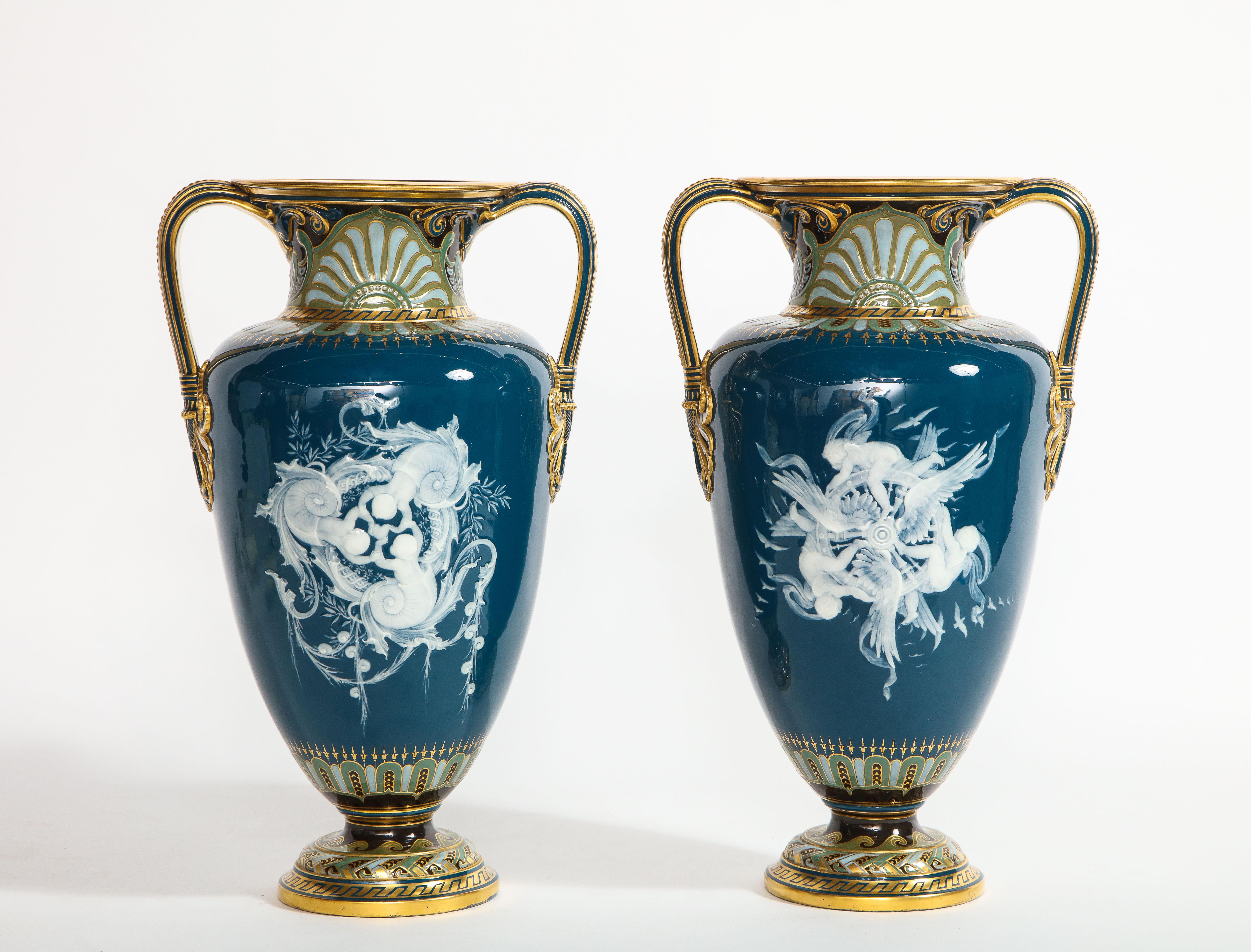 British Pr. Mintons Pâte-sur-pâte Blue-Ground Vases, 'Too Fast' & 'Too Slow', L. Solon