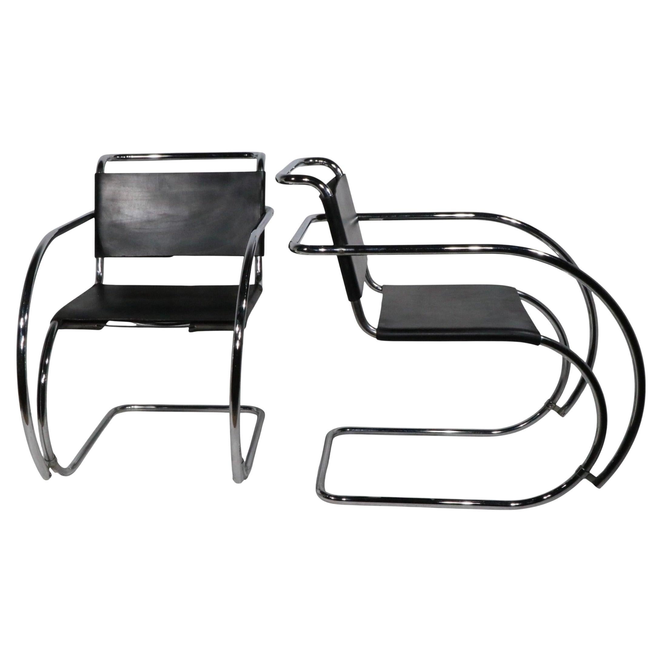 Chic pair of classic Mr. Chairs, originally designed by Mies van Der Rohe at the Bauhaus, these example are later production, made in Italy by Palazetti, circa 1970/80's. True to the originals, they feature dramatic bent tubular chrome frames with