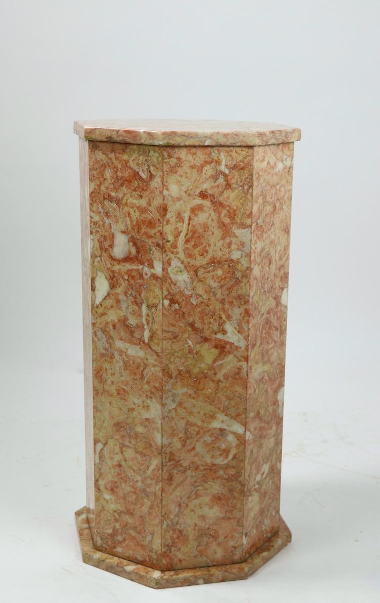 Stunning matched pair of rouge marble pedestals. Each pedestal has an octagonal top, column and base, both are in very good clean and original ready to use condition. Probably made in Italy, but unsigned.