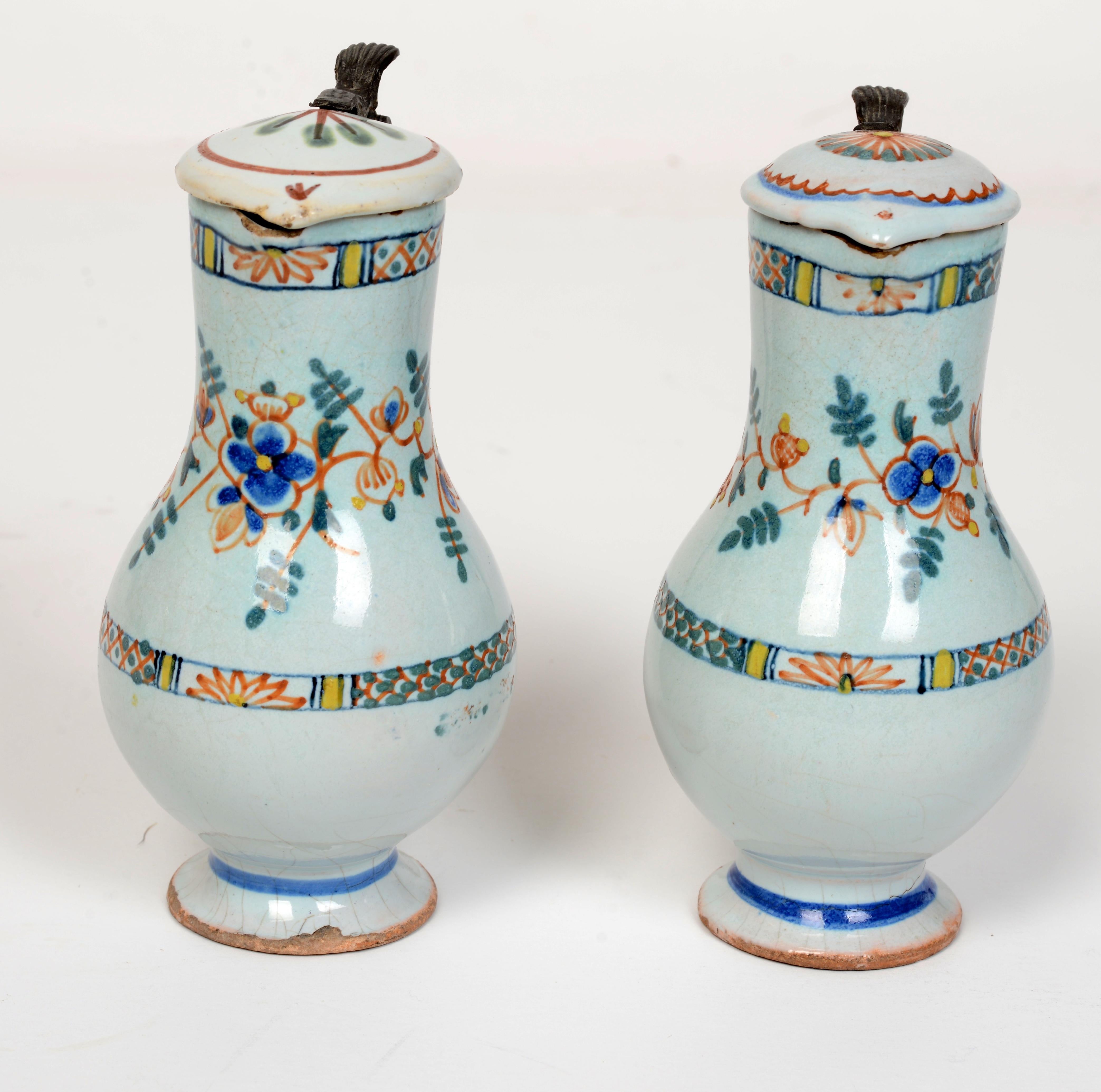 Polychromed Pr of 19th c French Faience Poly-Chrome Painted Small Pitchers With Hinged Lids For Sale