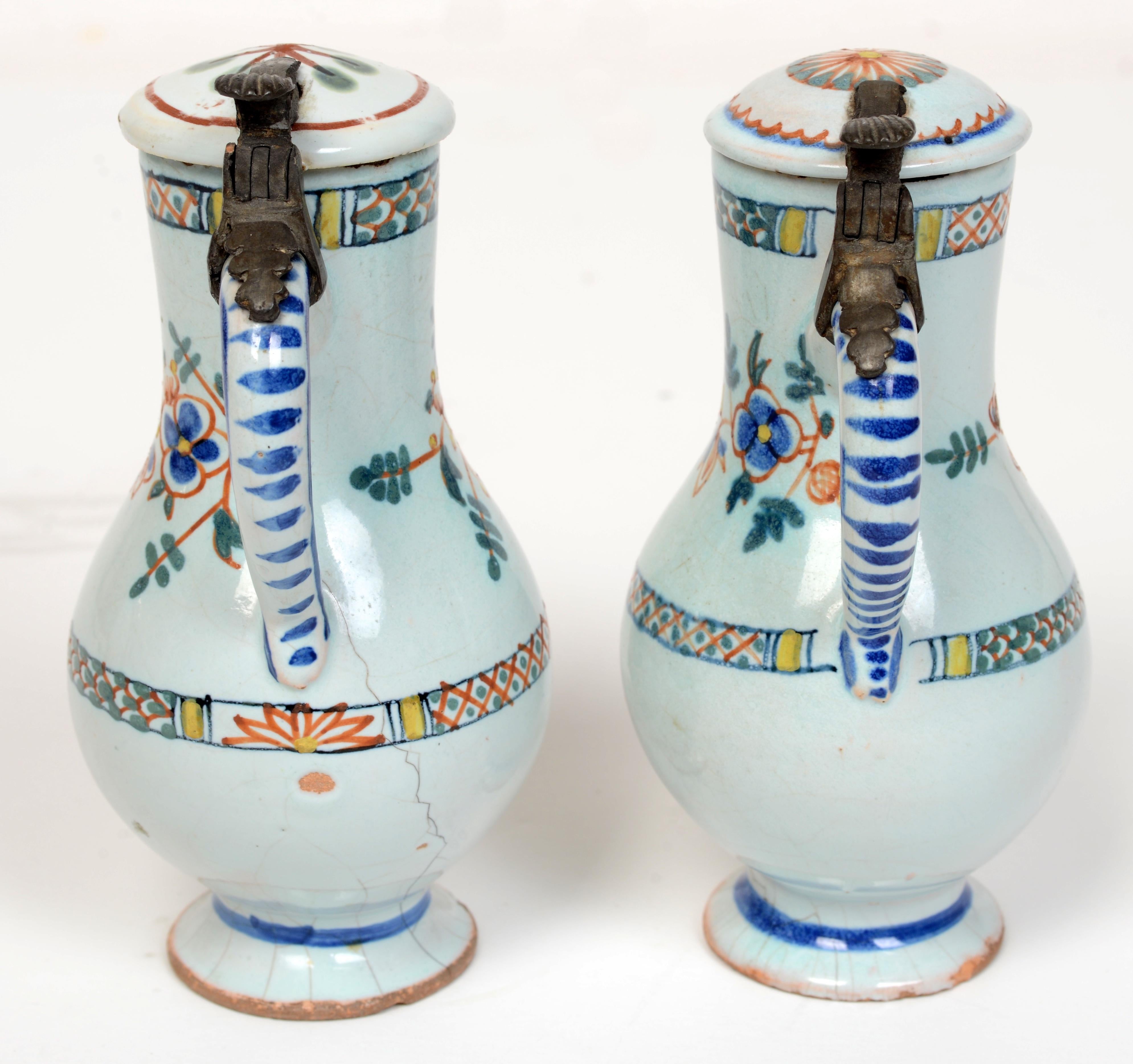 Pr of 19th c French Faience Poly-Chrome Painted Small Pitchers With Hinged Lids In Good Condition For Sale In valatie, NY
