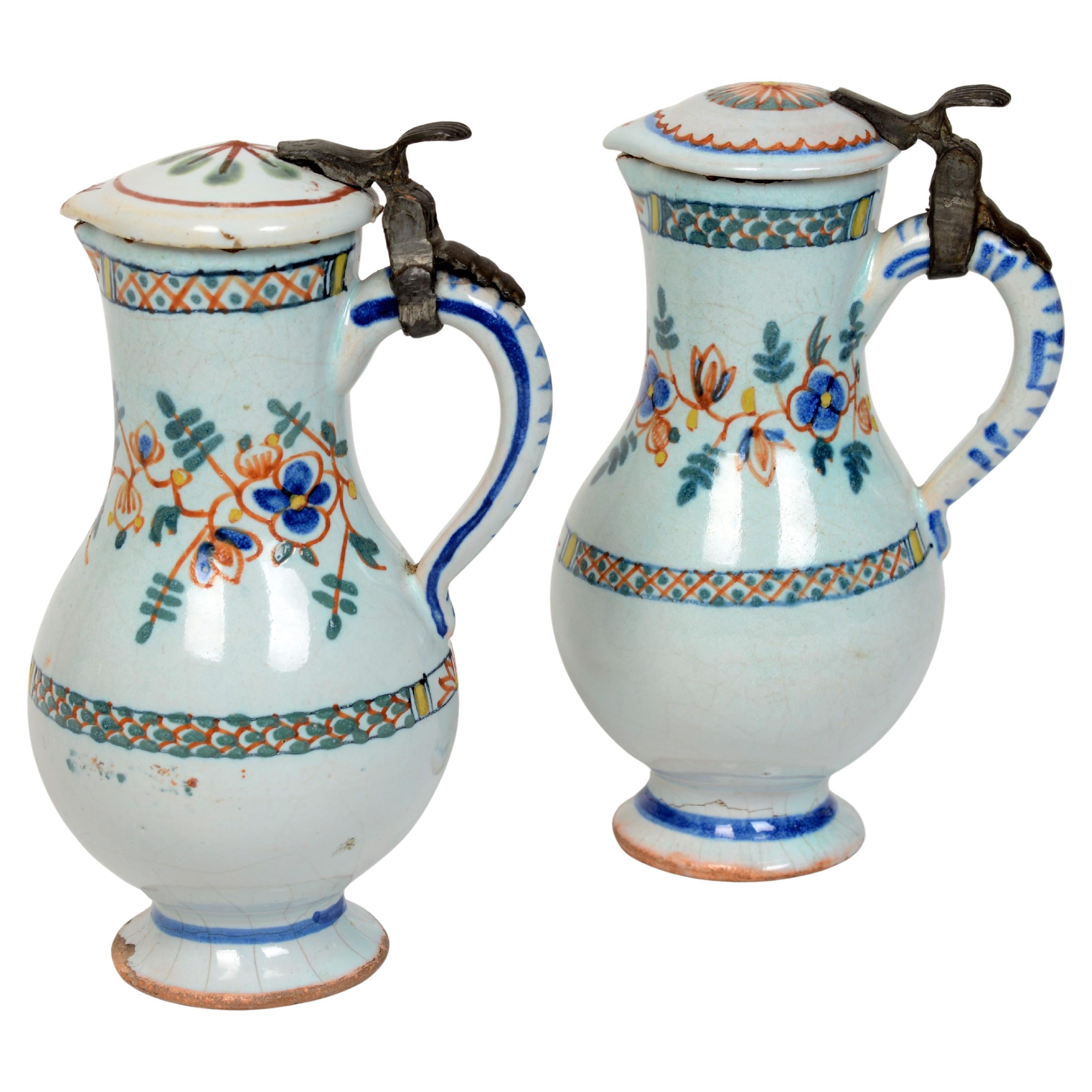 Pr of 19th c French Faience Poly-Chrome Painted Small Pitchers With Hinged Lids For Sale