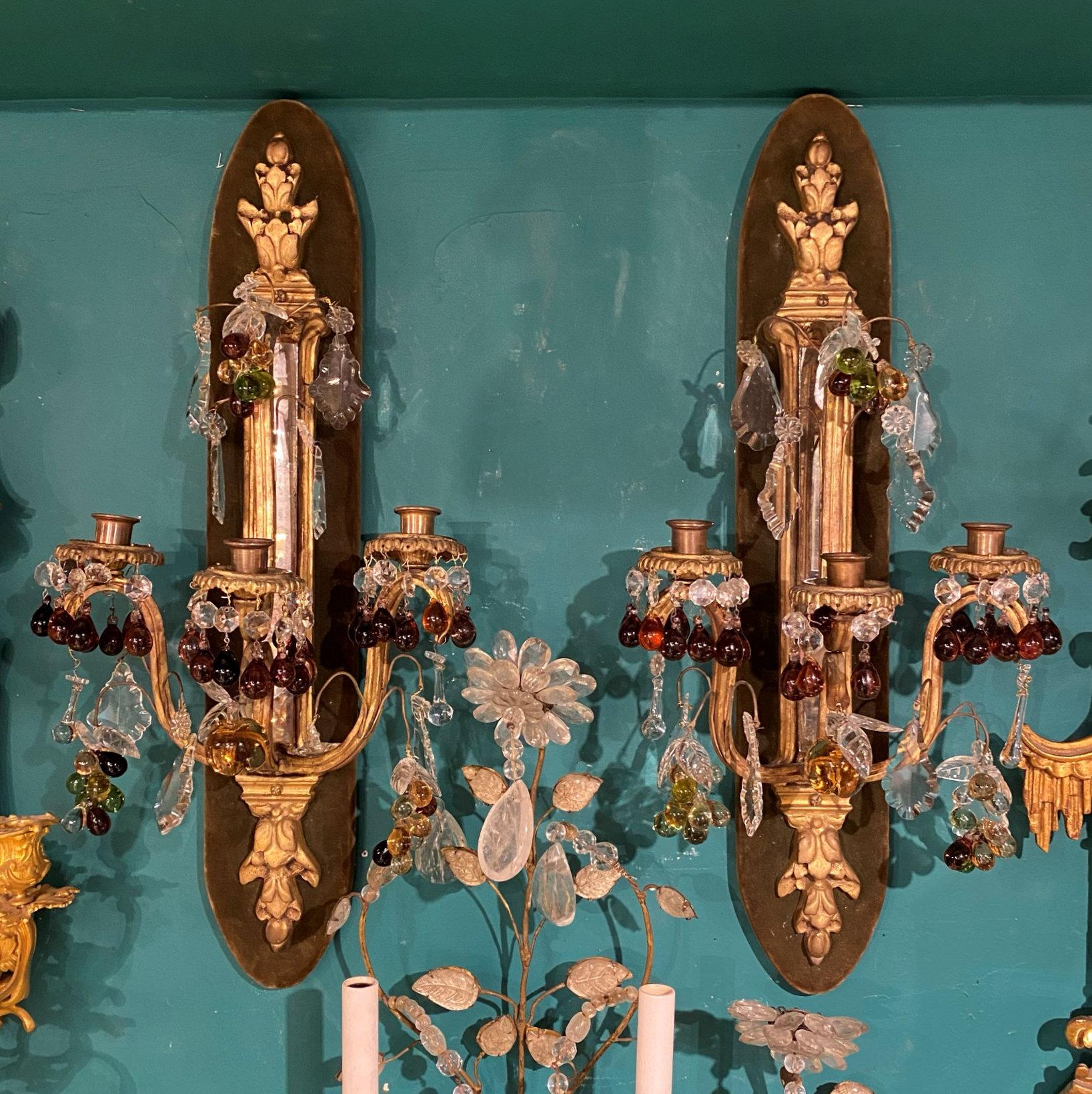 pr of French 19 century Bronze and crystal Sconces with Fruit Shaped Crystal Pendants.
Backed by wooden backplate covered in textile.
Not Wired for electricitity yet.