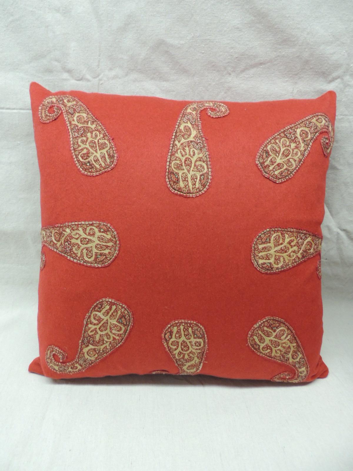 Pair of red Persian paisley hand-applique embroidered paisleys onto a red wool carriage cloth textile. 
Throw pillows finished with a small Rubelli silk velvet backings. 
Pillows handmade and designed in the USA. 
Closure by stitch (no zipper) with