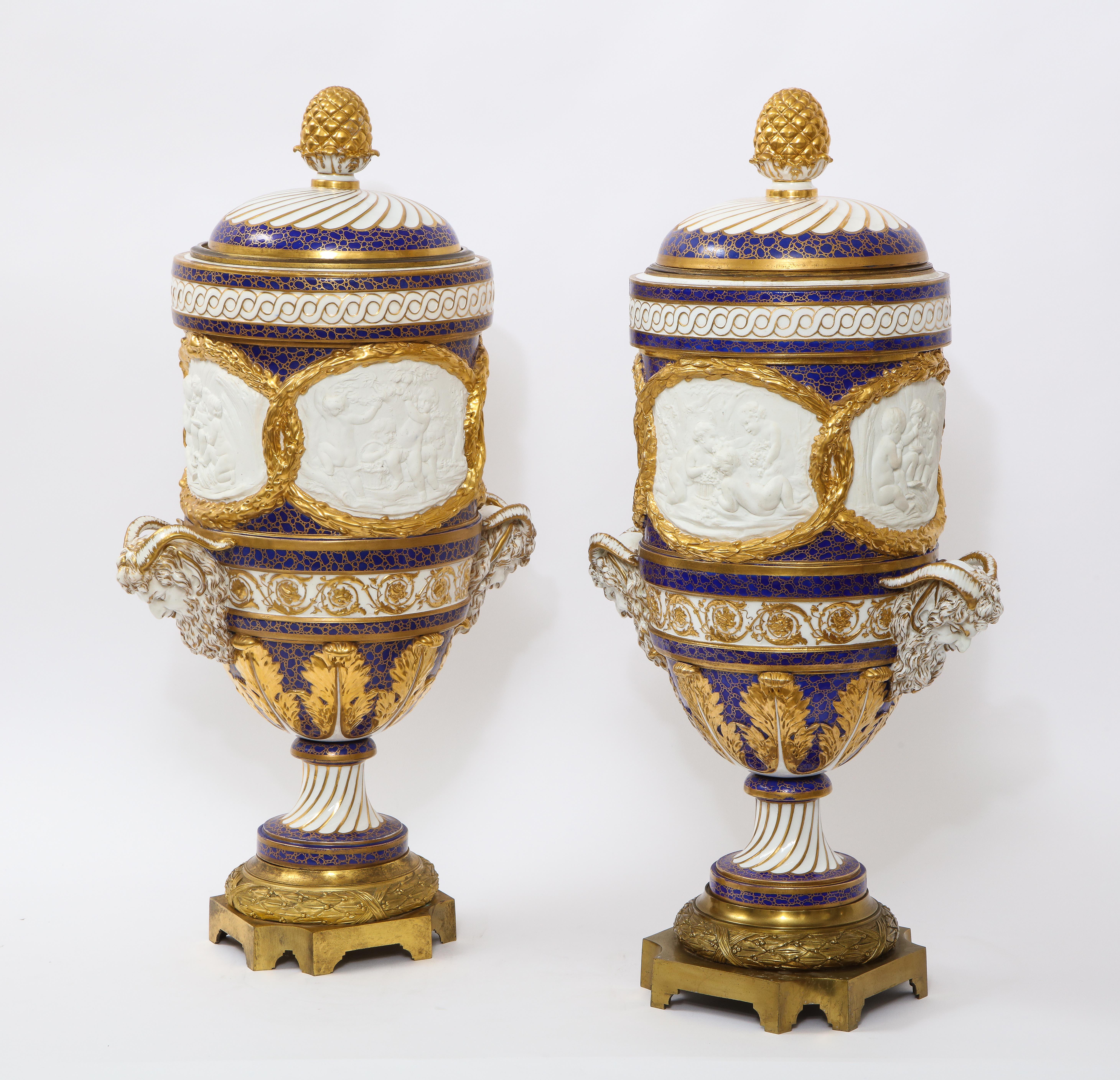 An elaborate and monumental pair of 19th century Ormolu Mounted French Sevres Porcelain and biscuit porcelain cobalt blue ground 