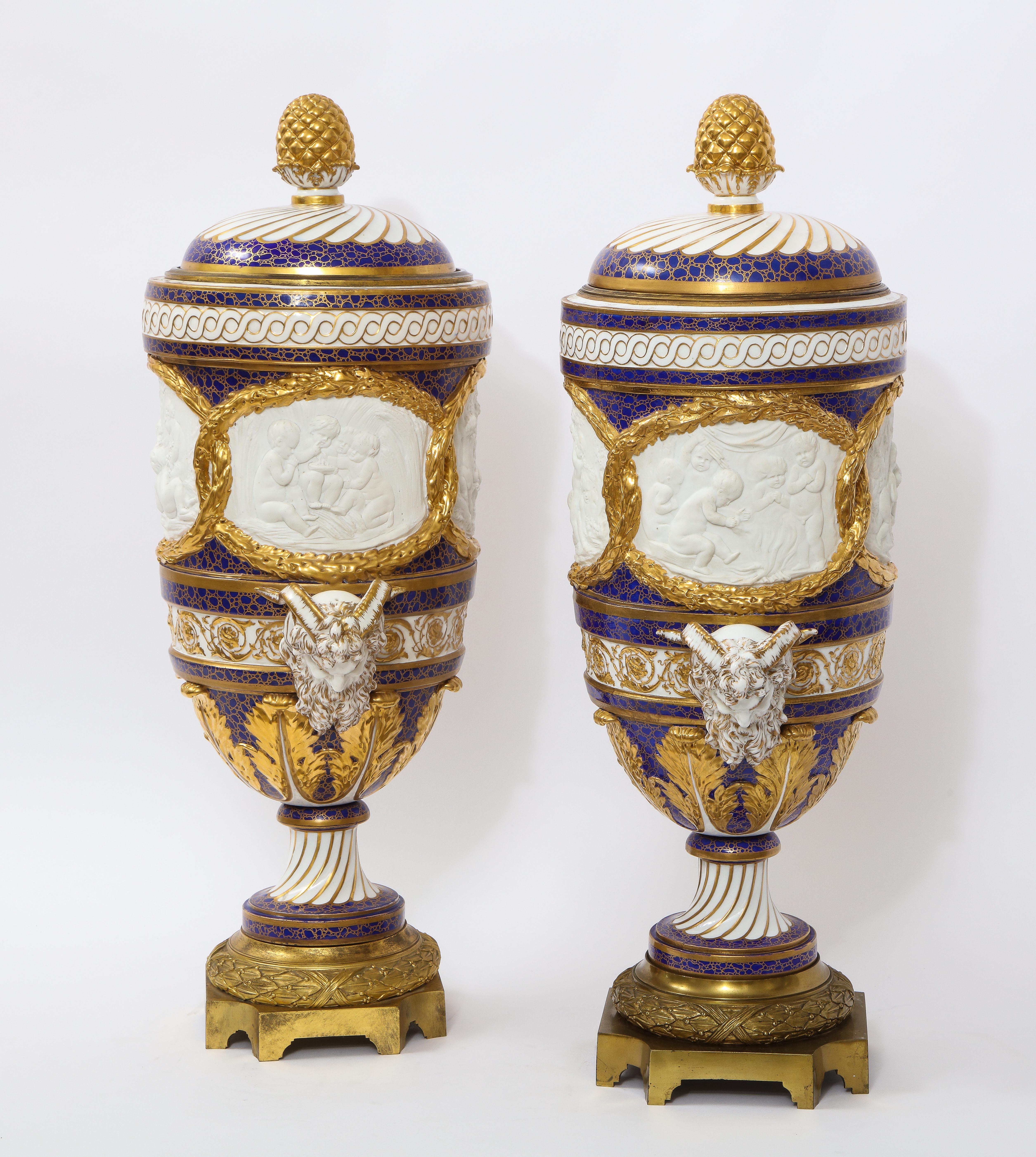 Hand-Painted Pr Ormolu Mtd French Sevres Biscuit & Porcelain Cobalt Blue Ground Seasons Vases For Sale