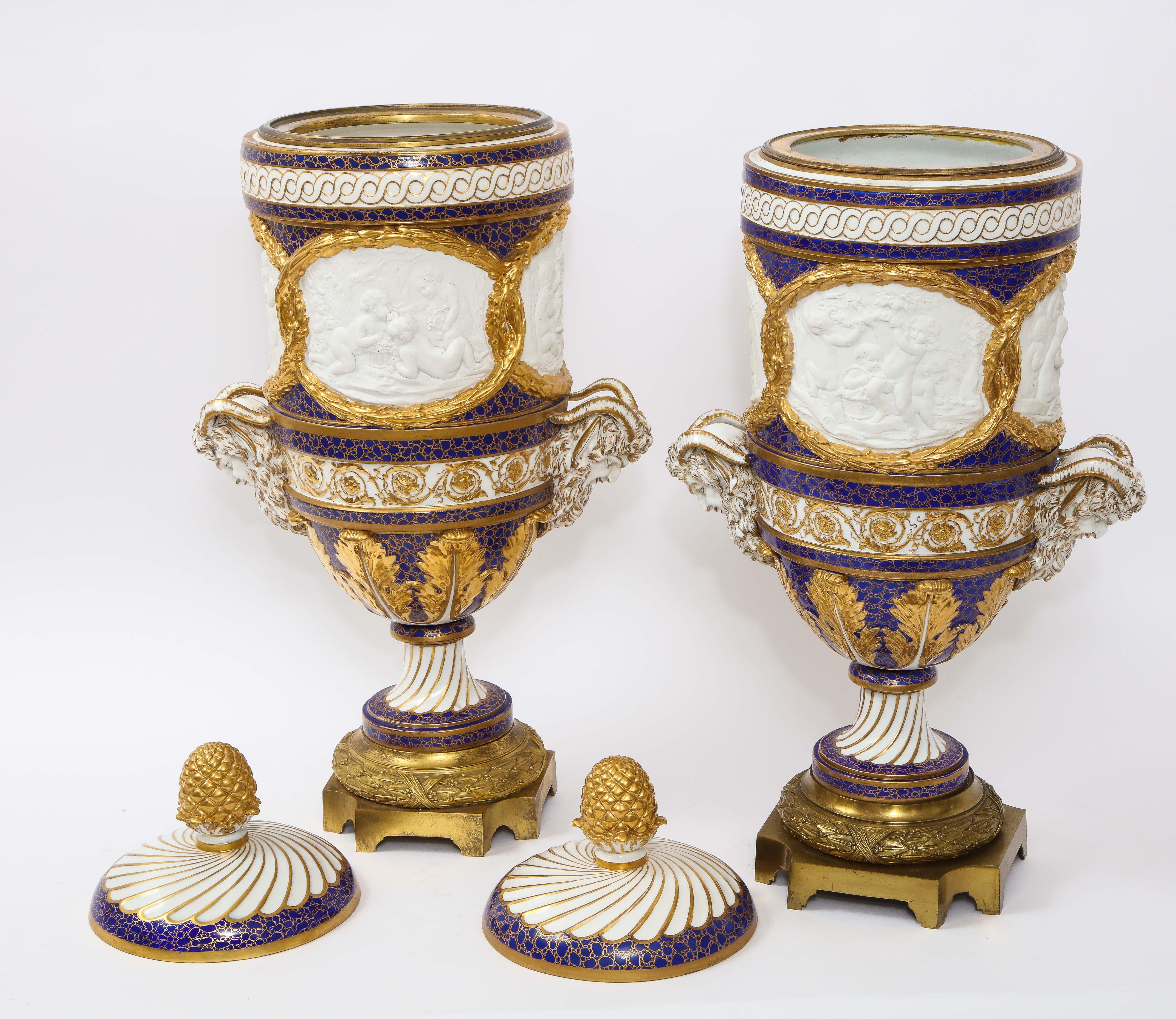 Pr Ormolu Mtd French Sevres Biscuit & Porcelain Cobalt Blue Ground Seasons Vases In Good Condition For Sale In New York, NY