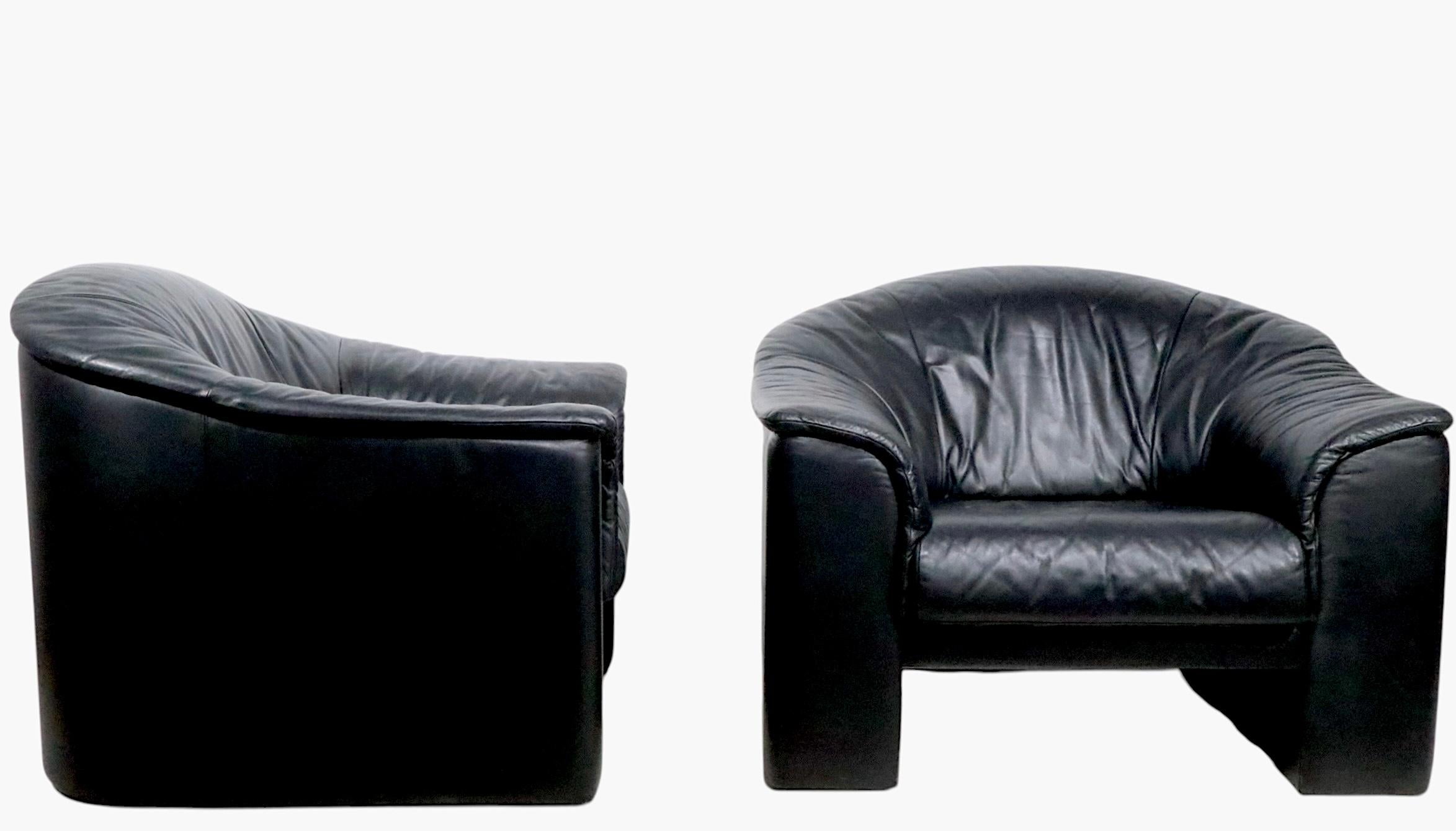 Chic pair of over scale lounge, or club chairs in black leather - made by the Brayton International Collection, circa 1991. These exceptional chairs are  very well constructed, comfortable, and in very fine, original condition, showing only light