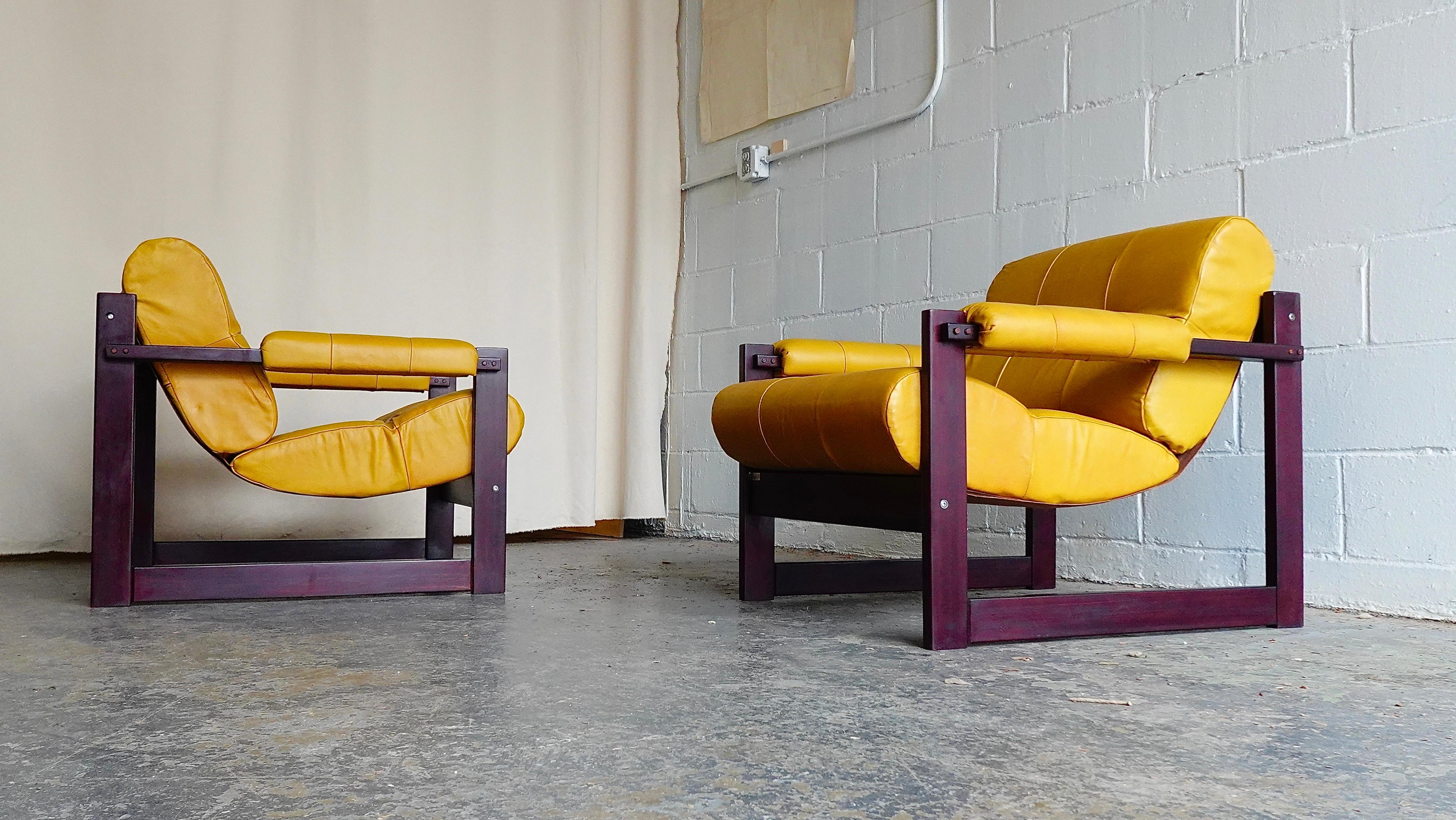An attractive pair of Percival Lafer’s celebrated MP-167 lounge chairs in Jatoba wood and original yellow leather upholstery, marked with manufactures label and retailer’s mark. 

Rare to find such a well preserved all original example in this