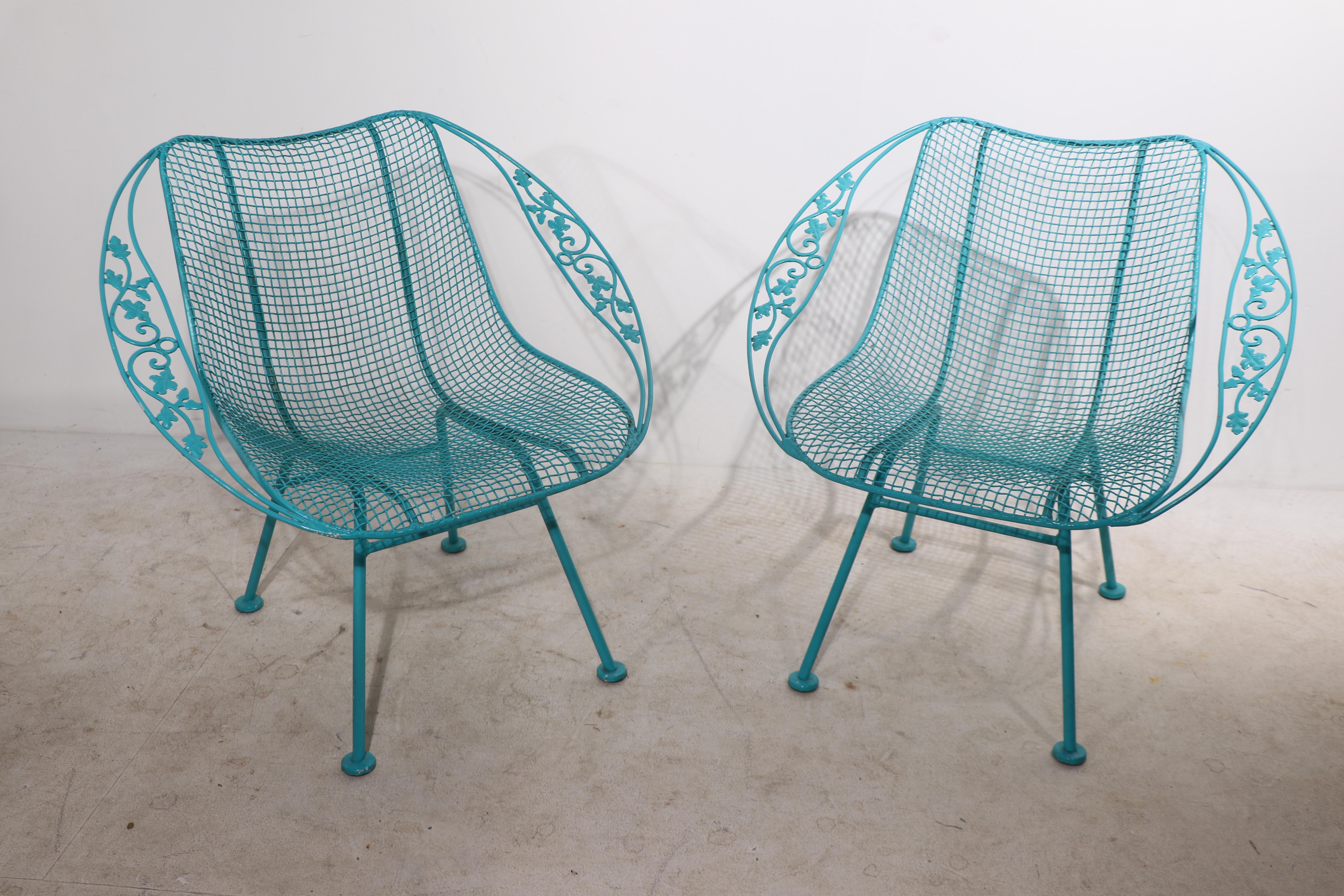 Exceptional pair of Woodard Sculpture Satellite lounge chairs, in turquoise paint finish. Both are in very good condition, clean and ready to use. We offer custom powder coating if you prefer a different finish. Offered and priced as a pair. 
