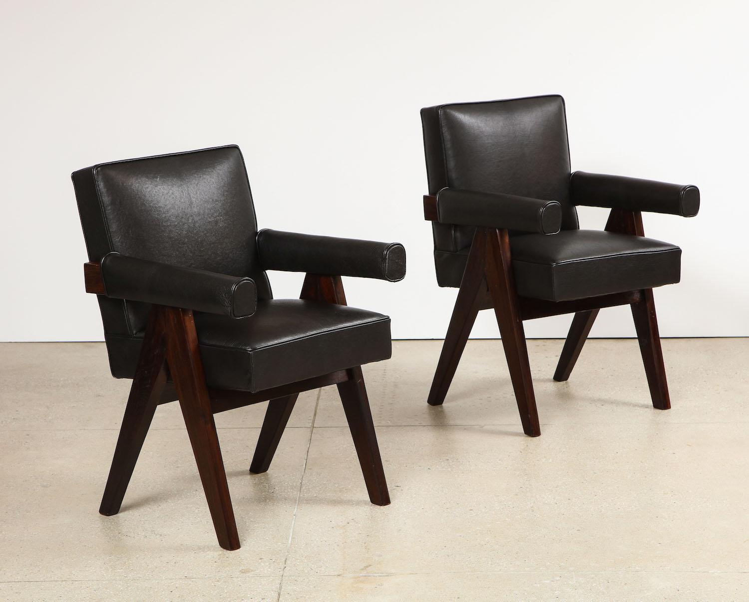 Pair of Senat Armchairs by Pierre Jeanneret.  Dark-stained teak, leather. Produced for the High Court Legislative Assembly, Chandigarh, India. Recently re-upholstered.