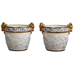 Pr Sevres Biscuit Porcelain Putti Decorated Centerpieces w Gilt Rams Head Handle