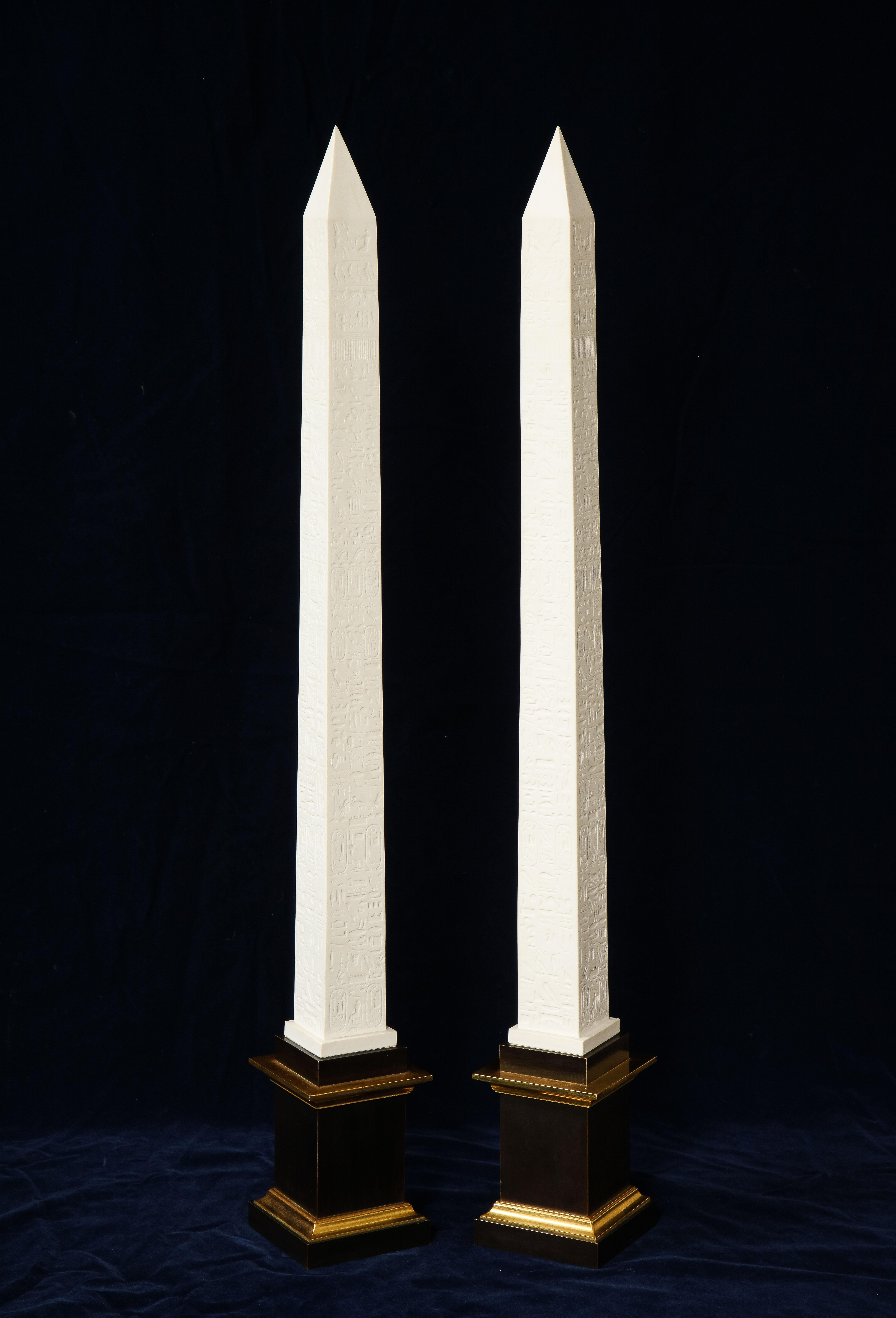 A fabulous and quite unusual pair of original signed and marked Sevres Porcelain patinated and gilt bronze mounted Egyptian Inspired Hyroglifics biscuit Porcelain obelisks. These are truly an amazing pair of Sevres biscuit Porcelain obelisks. It is