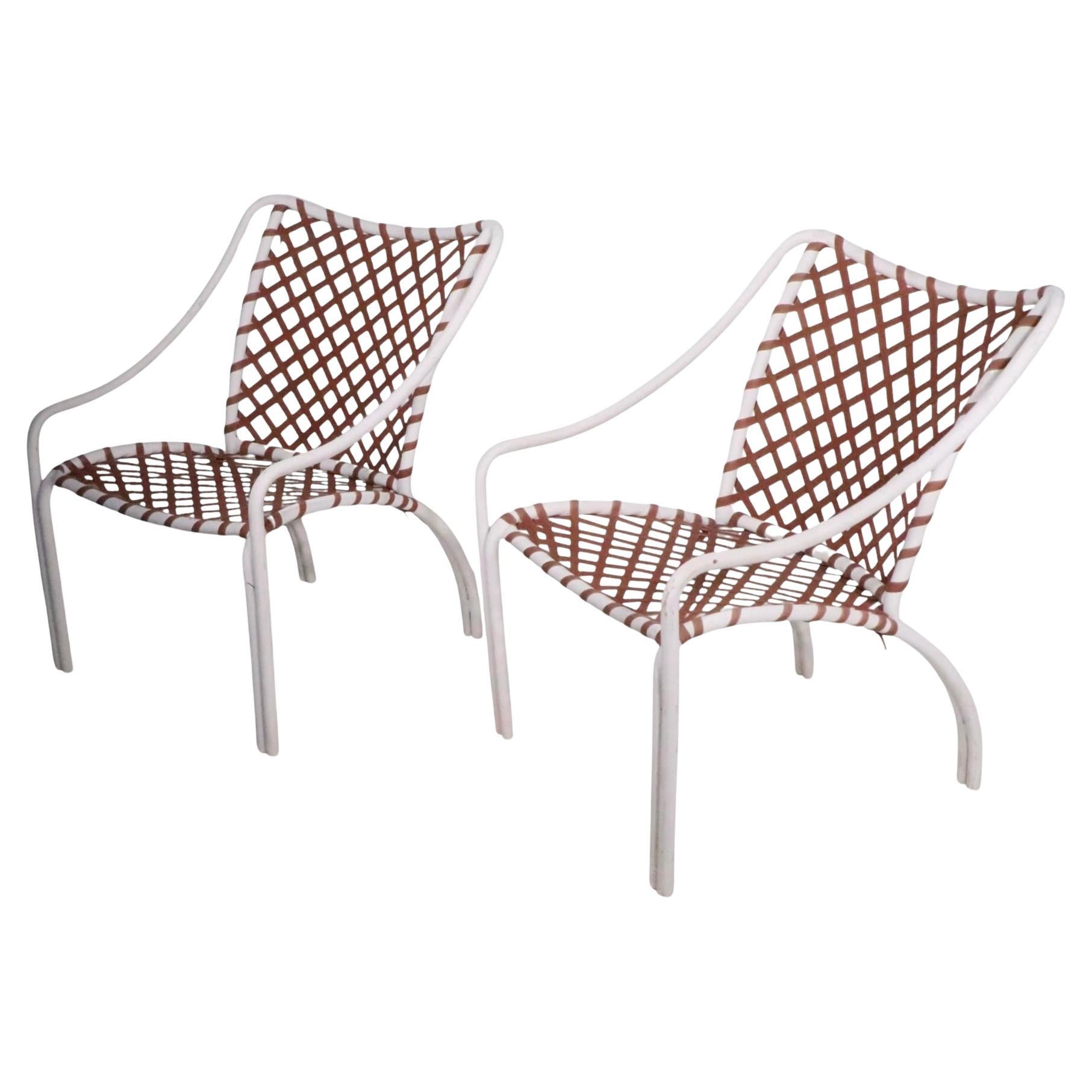 Pr. high style vintage Brown Jordan lounge chairs, from the classic Tamiami series, designed by Hal Brady, c. 1960's. Both chairs are structurally sound and sturdy, one chair shows a break in the vinyl webbing, please see images. 
 Total H 31