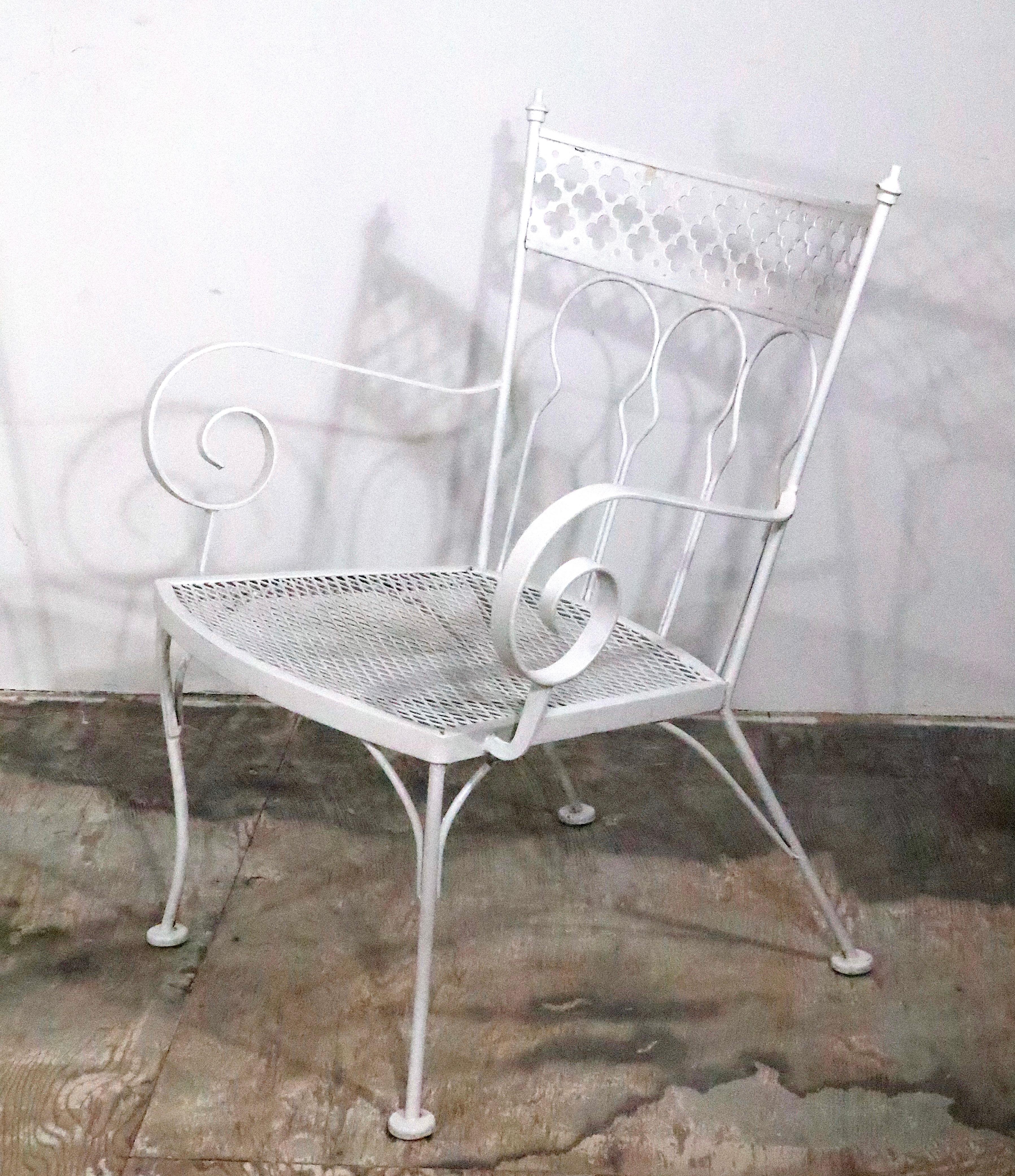 Pr. Taj Mahal Arm Chairs, by Salterini, constructed of wrought iron and metal mesh.  The chairs are in very good, original, clean and ready to use condition.
 Offered and priced as a pair, dimensions as follows:
 Total H 32.5 x Arm H 23.5 x Seat H