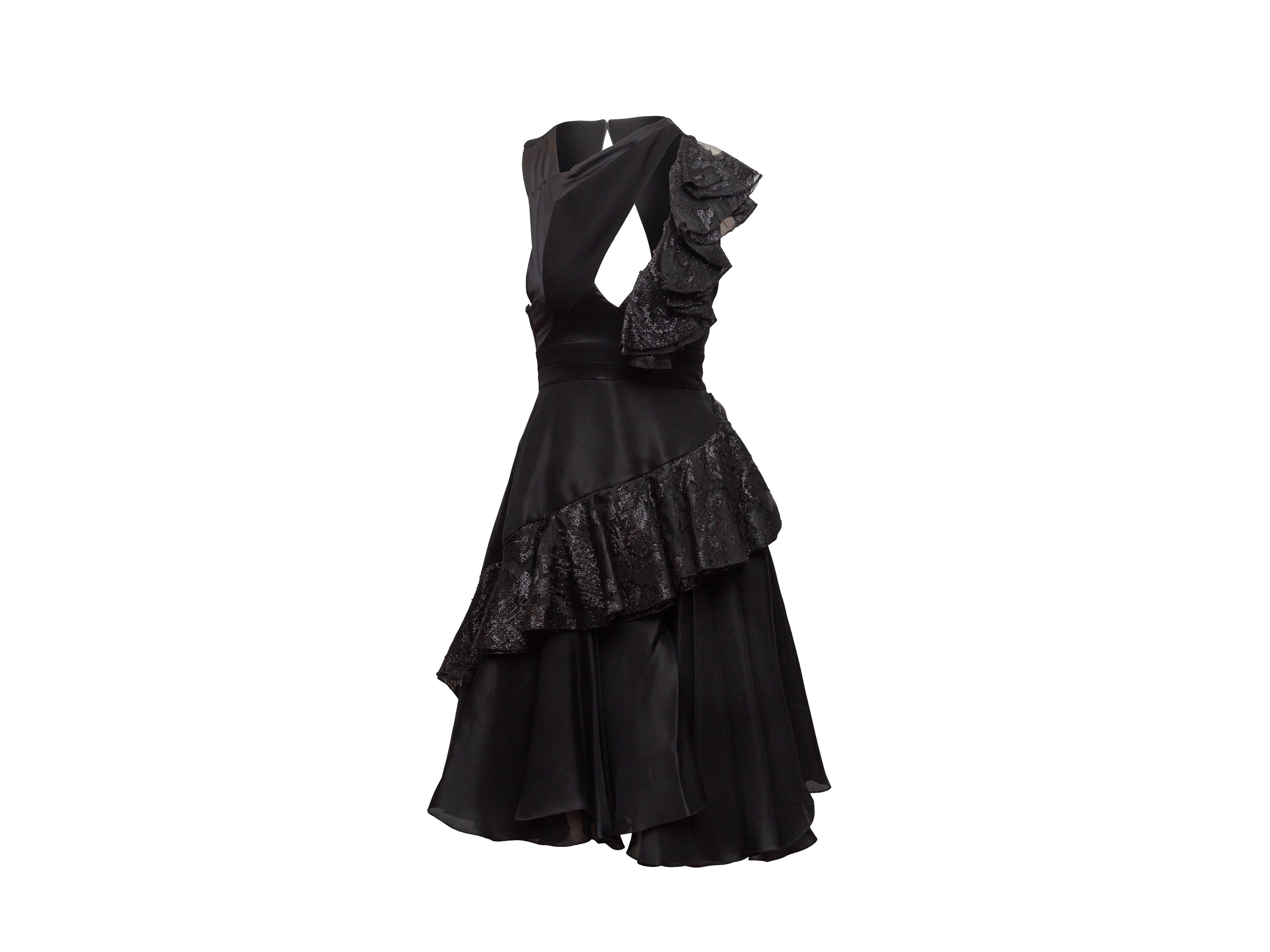 Product details: Black sleeveless ruffle-trimmed dress by Prabal Gurung. Cutout at bust. Zip closure at back. 28