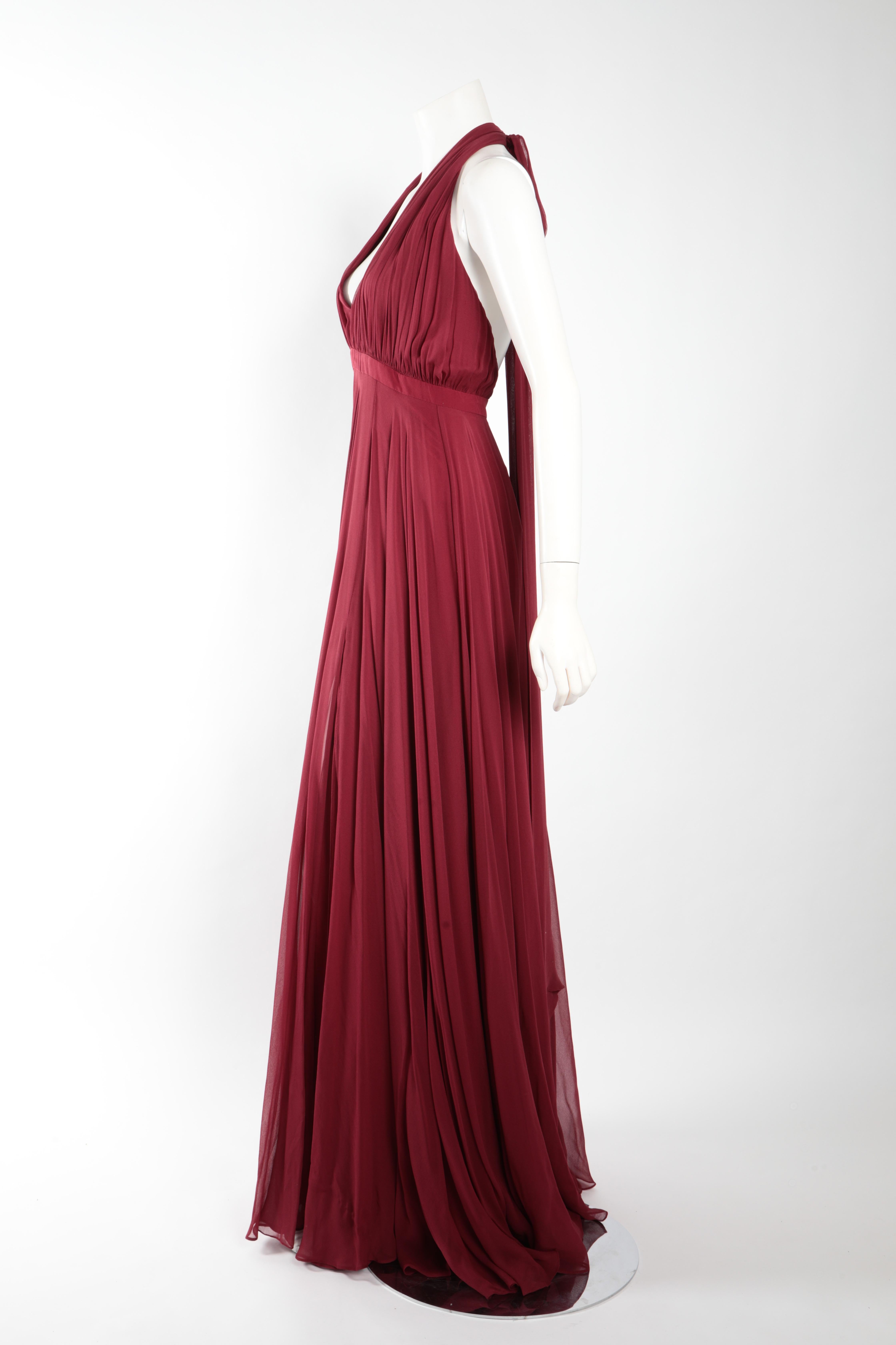 Floor-length burgundy chiffon gown by Prabal Gurung.
Halter tie neck, knife pleated skirt, with deep side slit. Fits size US 10. 
100% Silk