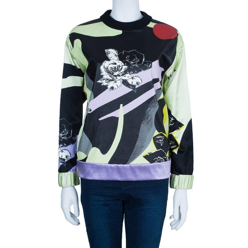 Be stylishly warm in this piece. This gorgeously unique sweatshirt top by Prabal Gurung looks catchy. It has been crafted in leather and comes in a multicolored print. Wear this with casual denim jeans and pair up with a wool muffler for a