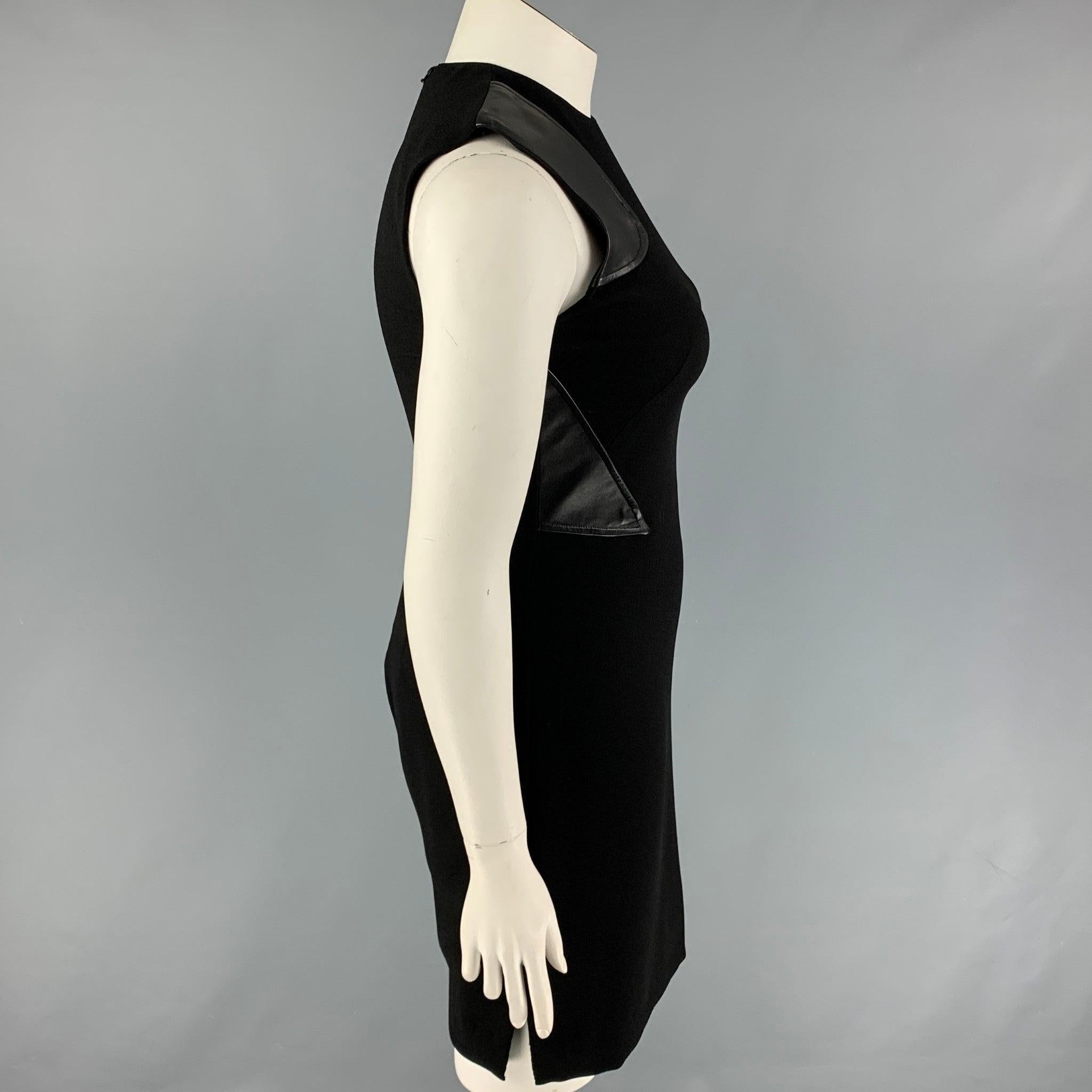 PRABAL GURUNG dress comes in a black polyester featuring a sheath style, leather trim embellishments, sleeveless, and a back zip up closure. Made in USA.
Very Good
Pre-Owned Condition. 

Marked:   10 

Measurements: 
 
Shoulder: 13 inches  Bust: 33