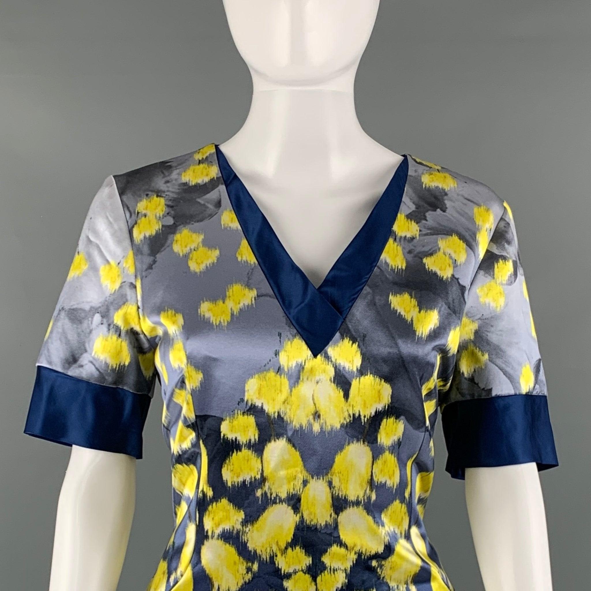 PRABAL GURUNG bellow knee dress comes in a blue and yellow abstract printed cotton and silk woven material featuring an A-line style, short sleeves, v-neck, and a back zip up closure. Made in New York City.Excellentd Pre-Owned Condition. 

Marked: 