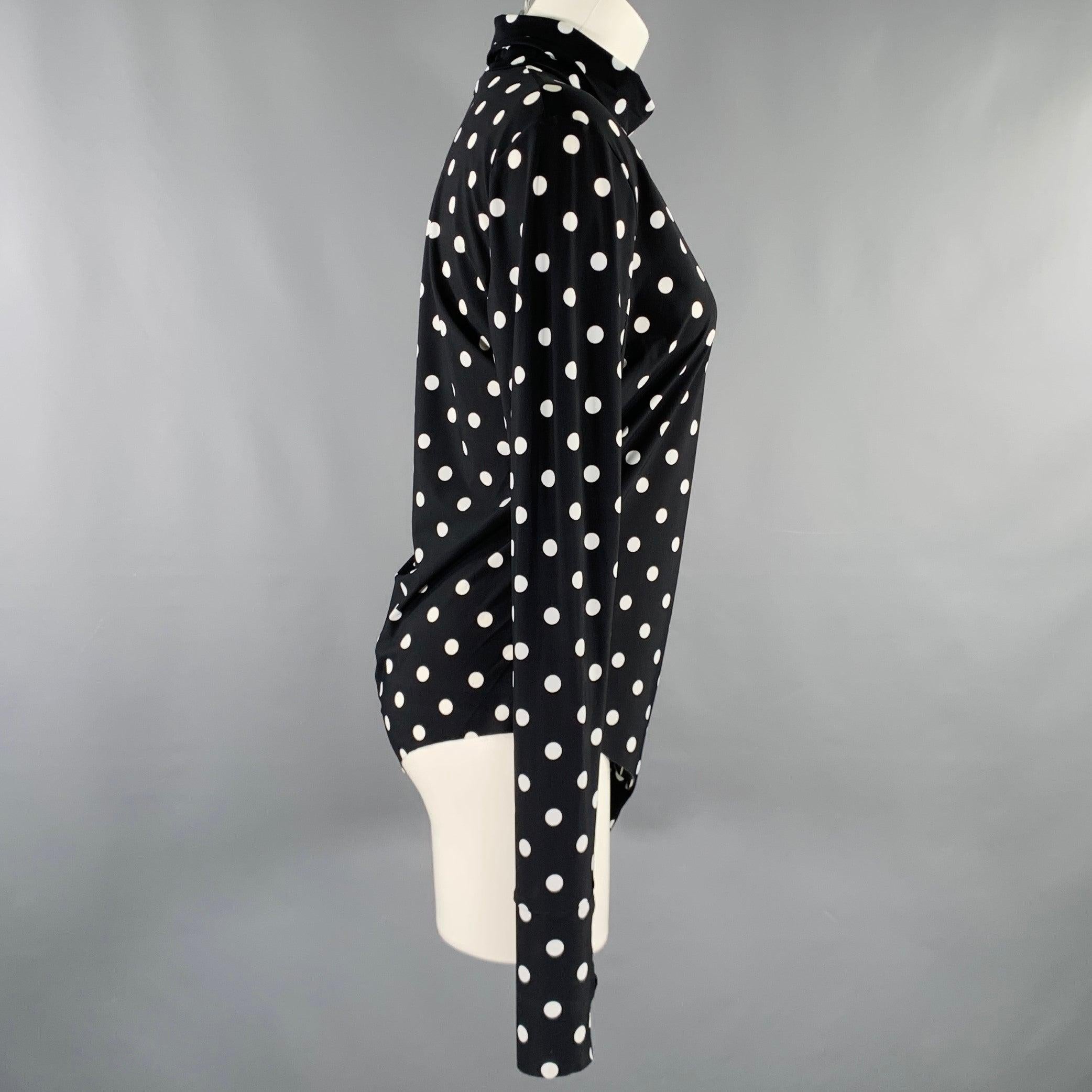 PRABAL GURUNG dress top
in a black and white lycra fabric featuring a polka dot pattern, bodysuit style with snap crotch, thumbholes in sleeves, and turtleneck. Made in USA.Very Good Pre-Owned Condition. Minor marks on turtleneck. 

Marked:   size