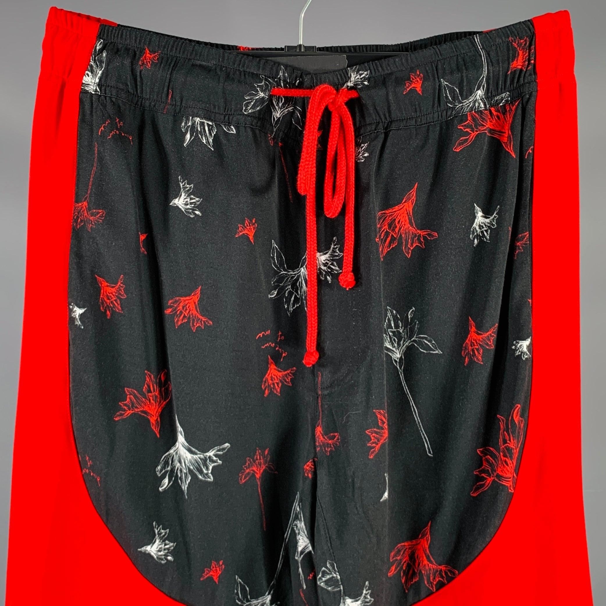 PRABAL GURUNG casual pants
in a
black and red fabric featuring a drop-crotch lounge pants style, floral print, and zip fly with drawstring closure. Excellent Pre-Owned Condition. Fabric and care tags removed. 

Marked:   size not marked.