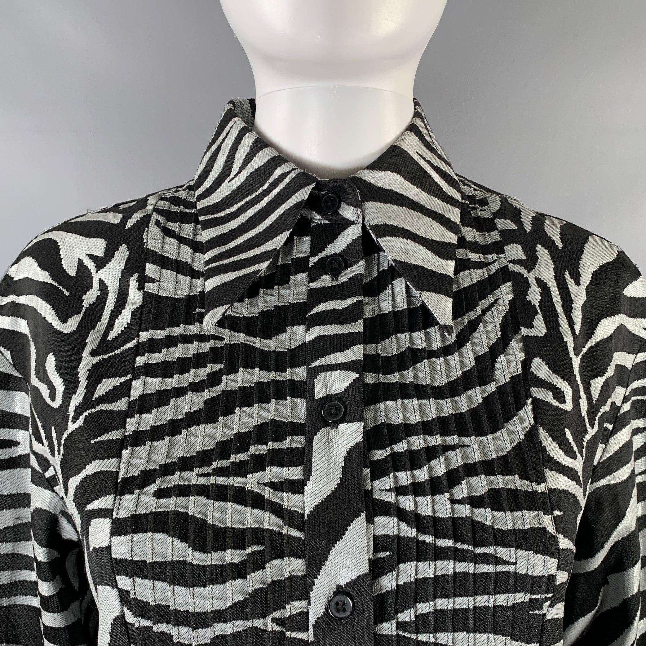 PRABAL GURUNG shirt dress comes in a black and silver animal print woven material featuring a long pointed collar, pleated tuxedo shirt detail, and a buttoned closure. Made in New York.Very Good Pre-Owned Condition. Signs of wear. 

Marked:   S
