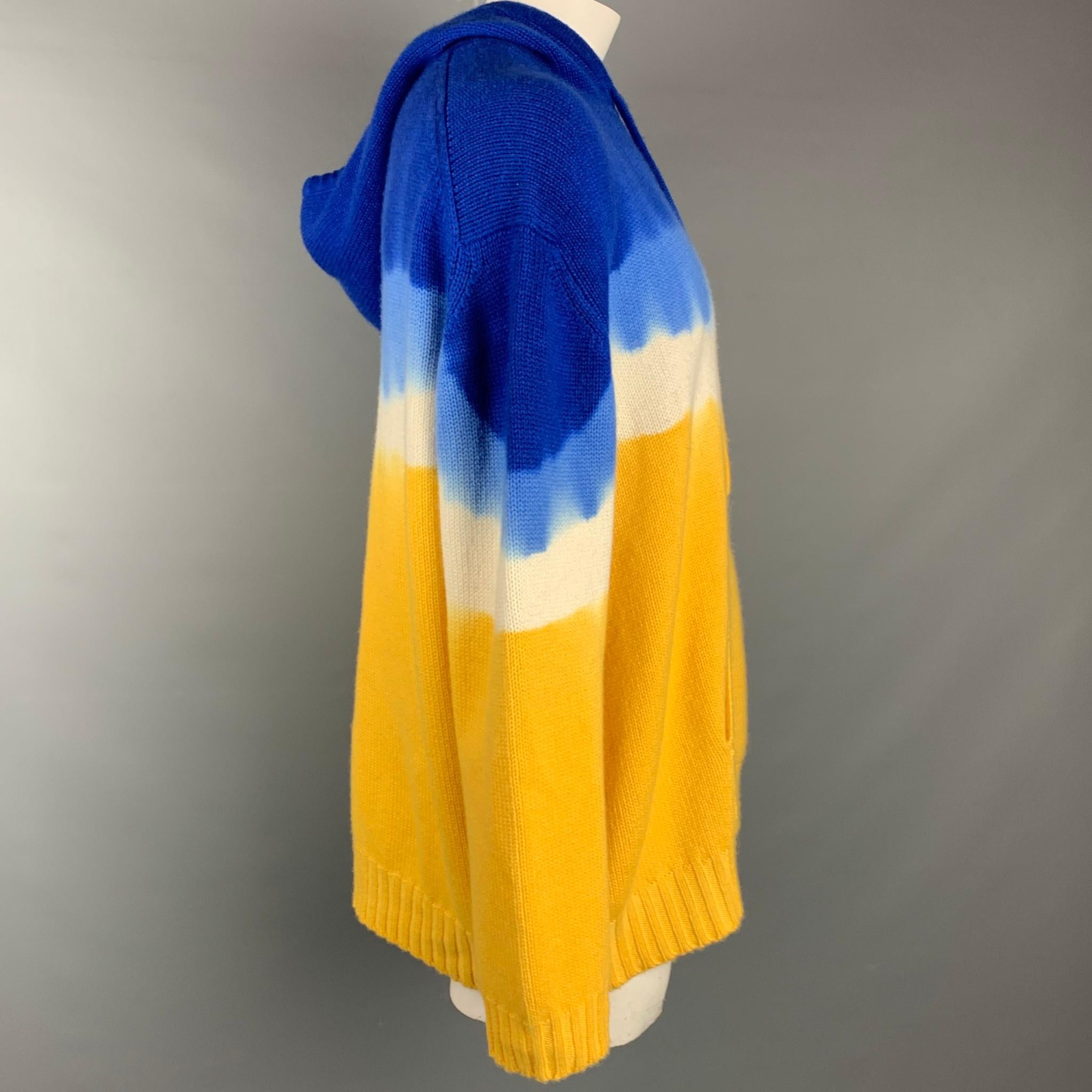 PRABAL GURUNG sweater comes in a blue & yellow knitted tie dye cashmere featuring a hooded style, front pocket, and a drawstring detail.

Very Good Pre-Owned Condition.
Marked: XL
Original Retail Price: $1,395.00

Measurements:

Shoulder: 25