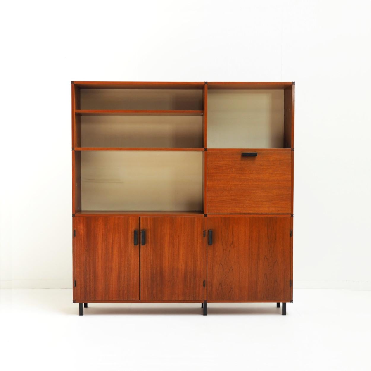 Very practical and contemporary cabinet designed by Cees Braakman for Pastoe. It consists of closed and open compartments together with a small writing desk (or bar cabinet). All shelves are adjustable (or removable), also those behind the