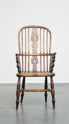 Practical antique English highback Windsor dining chair with graceful legs