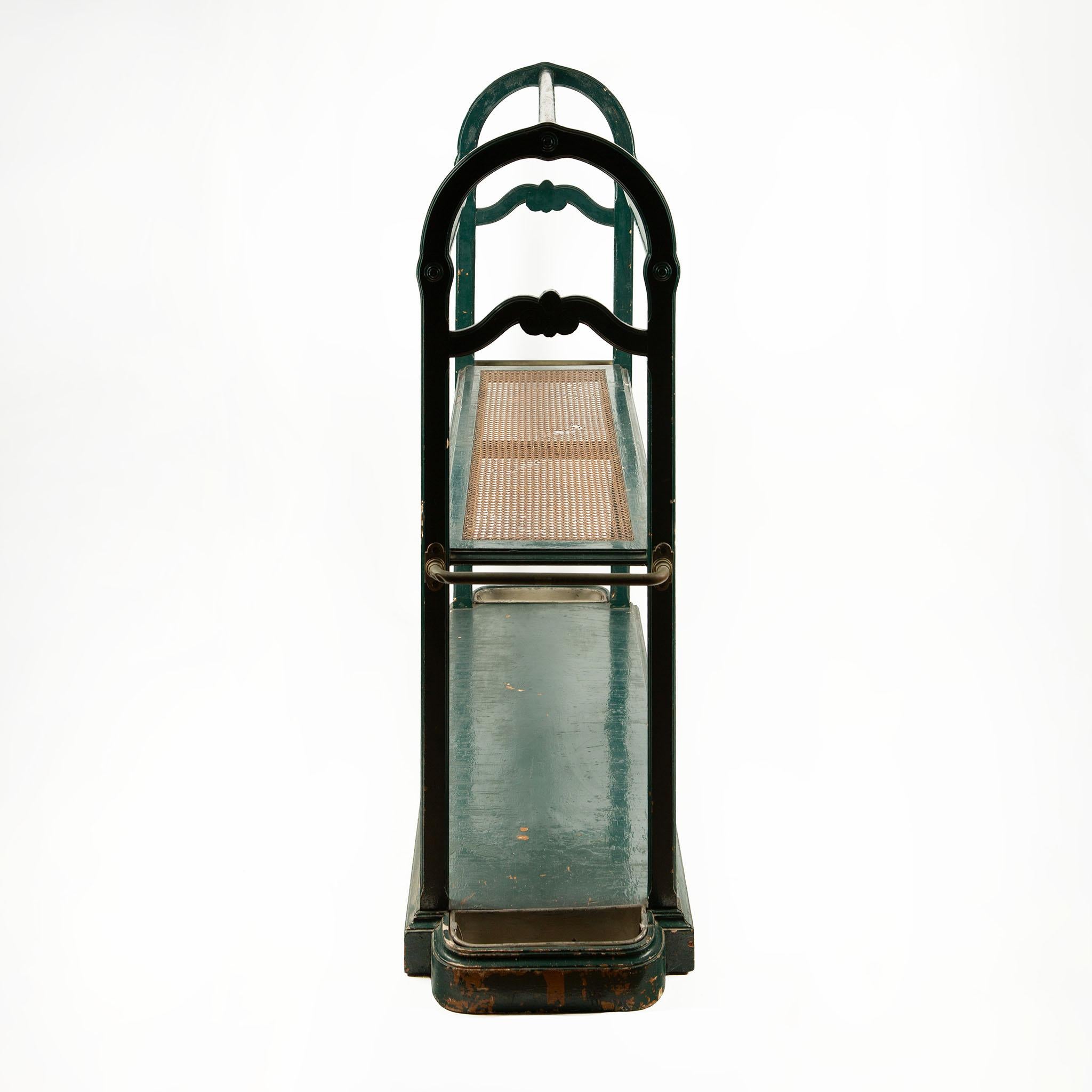 19th-Century Painted Wooden and Caned Hall Stand / Boot Rack Console
A charming late 19th-century jette habits hall stand, crafted in painted wood with a woven cane middle shelf, all original to the period. The piece features a sturdy rectangular